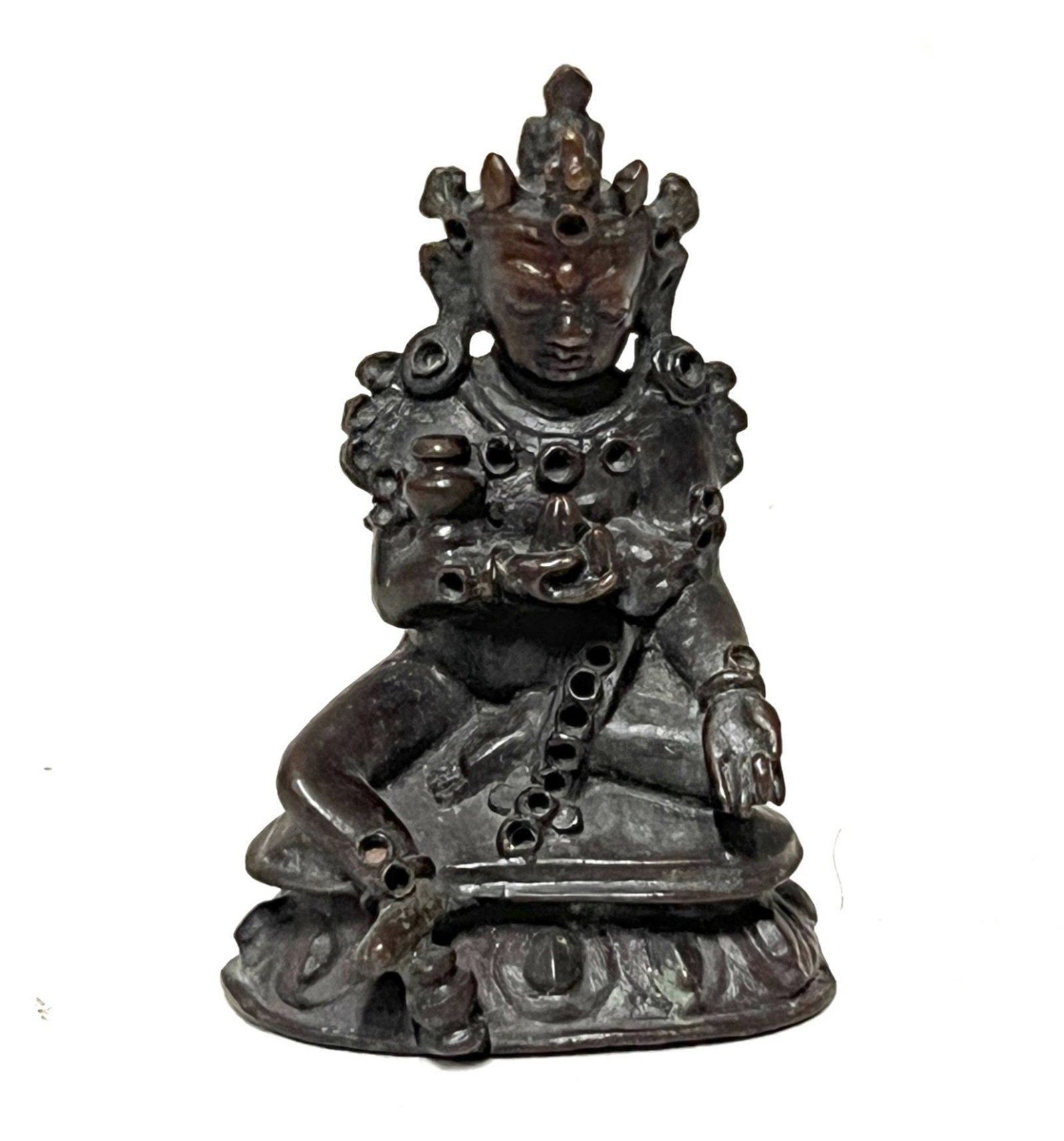 A BRONZE SEATED JAMBHALA: A BRONZE SEATED JAMBHALA Seated in lalitasana on lotus base, his left hand holding a mongoose, dressed in a billowing dhoti and adorned with beaded jewelry, the bearded face with wide eyes and bushy