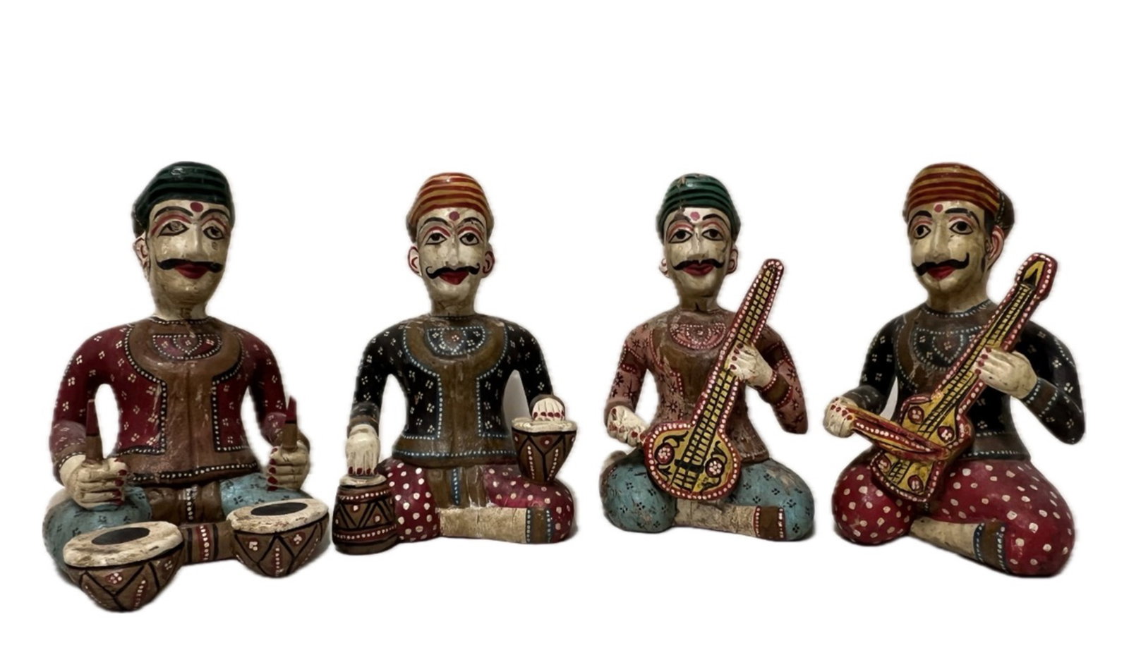 A INDIAN POLYCHROME PAINTED WOODEN MUSIC PLAYERS: A INDIAN HAND-PAINTED WOODEN RAJASTHANI MUSICIAN FIGURINES FEATURING TRADITIONAL INDIAN FOLK MUSICIANS. DIMENSION: A LIST OF RECOMMENDED THIRD-PARTY SHIPPER IS AVAILABLE UNDER SHIPPING INFORMATION.