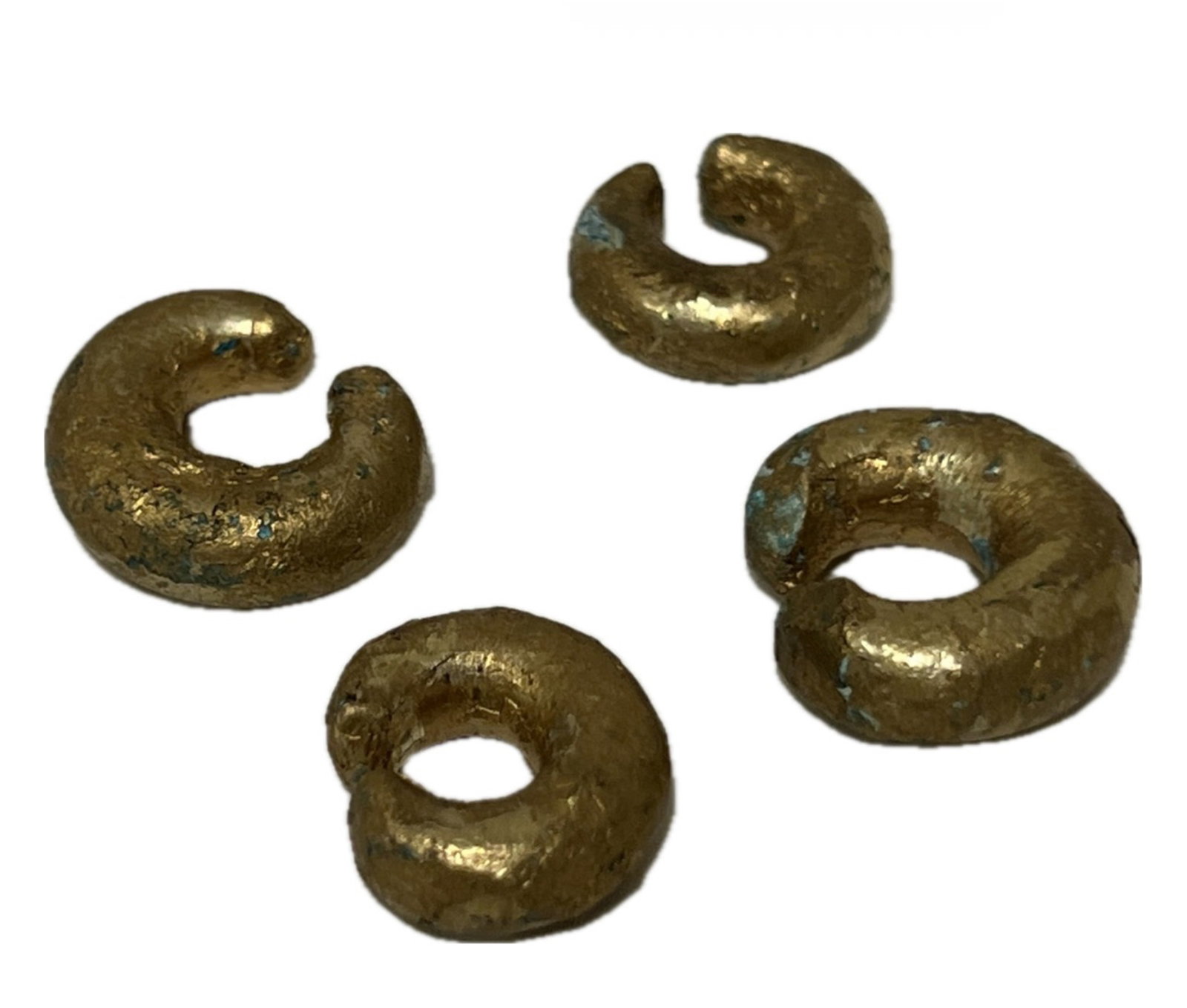4 GOID LEAF ON BRONZE NOSE RING PRECOLOMBIAN: 4 GOID LEAF ON BRONZE NOSE RING PRECOLOMBIAN. FROM NEW YORK COLLECTOR. DIMENSION: Diam. 1.5 cm. A LIST OF RECOMMENDED THIRD-PARTY SHIPPER IS AVAILABLE UNDER SHIPPING INFORMATION. PLEASE FEEL FREE TO