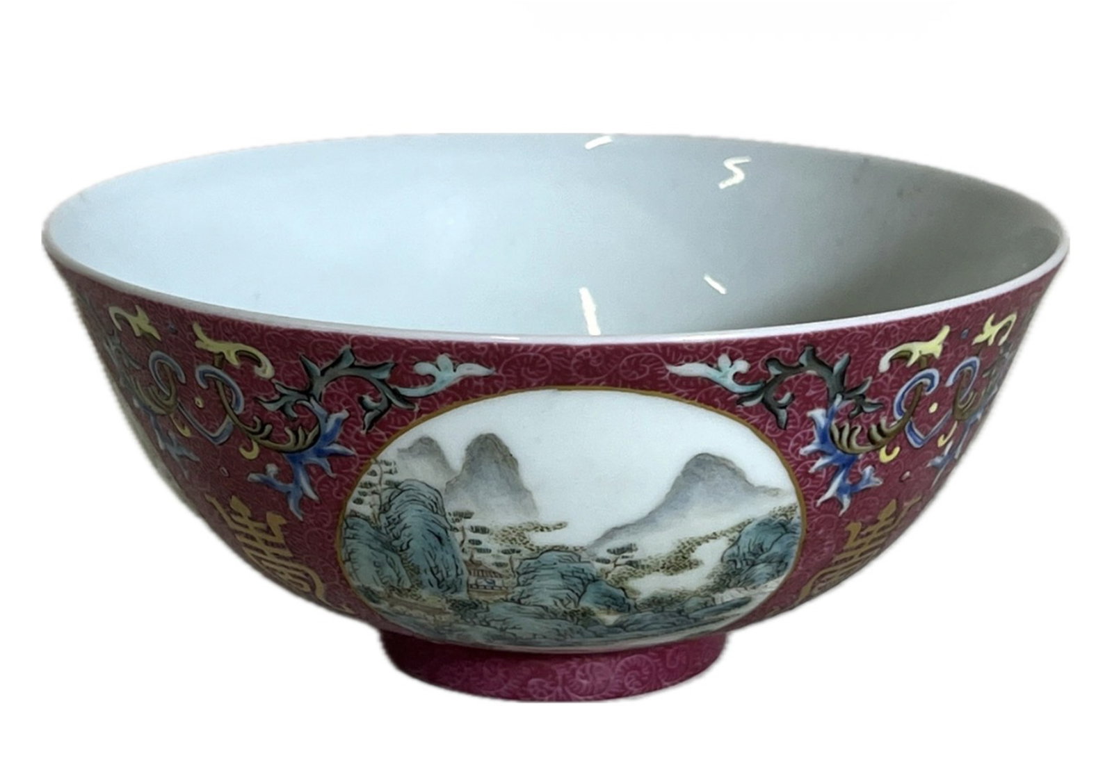 A FAMILLE ROSE MEDALLION BOWL: A FAMILLE ROSE MEDALLION BOWL Decorated with landscape at the reserved window, surrounded with flower sprays. FROM NEW YORK COLLECTOR. DIMENSION: Caliber. 16 cm. H. 7 cm. A LIST OF RECOMMENDED