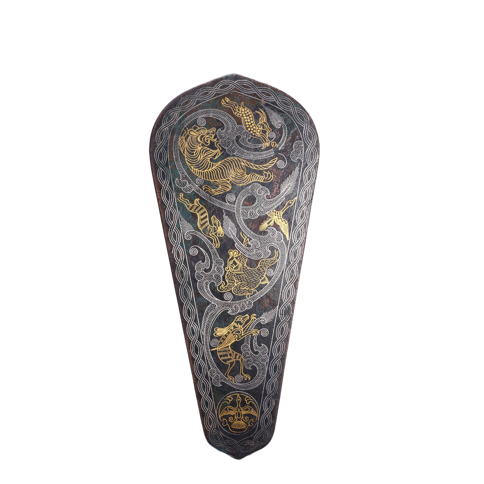 A FINE AND VERY RARE GOLD AND SILVER INLAID BRONZE ORNAMENT DANGLU: A FINE AND VERY RARE GOLD AND SILVER INLAID BRONZE ORNAMENT DANGLU The ornament casted as cover of horse's nostrils, decorated with layers of archaistic patterns, accented with gold and silver inlay.