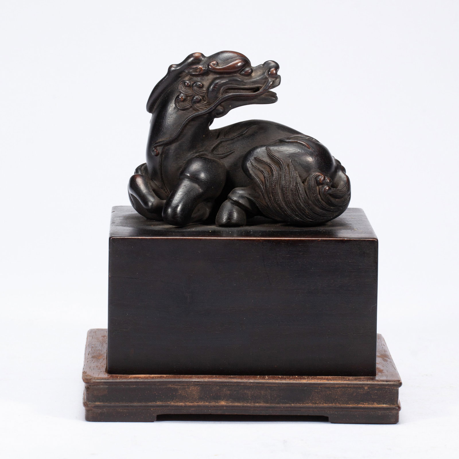 A CARVED ROSEWOOD ZITAN MYTHICAL BEAST KYLIN: A CARVED ROSEWOOD ZITAN MYTHICAL BEAST KYLIN Zitan is a general term which includes numerous species of wood, however, it is commonly agreed that it belongs to the genus Pterocarpus. A