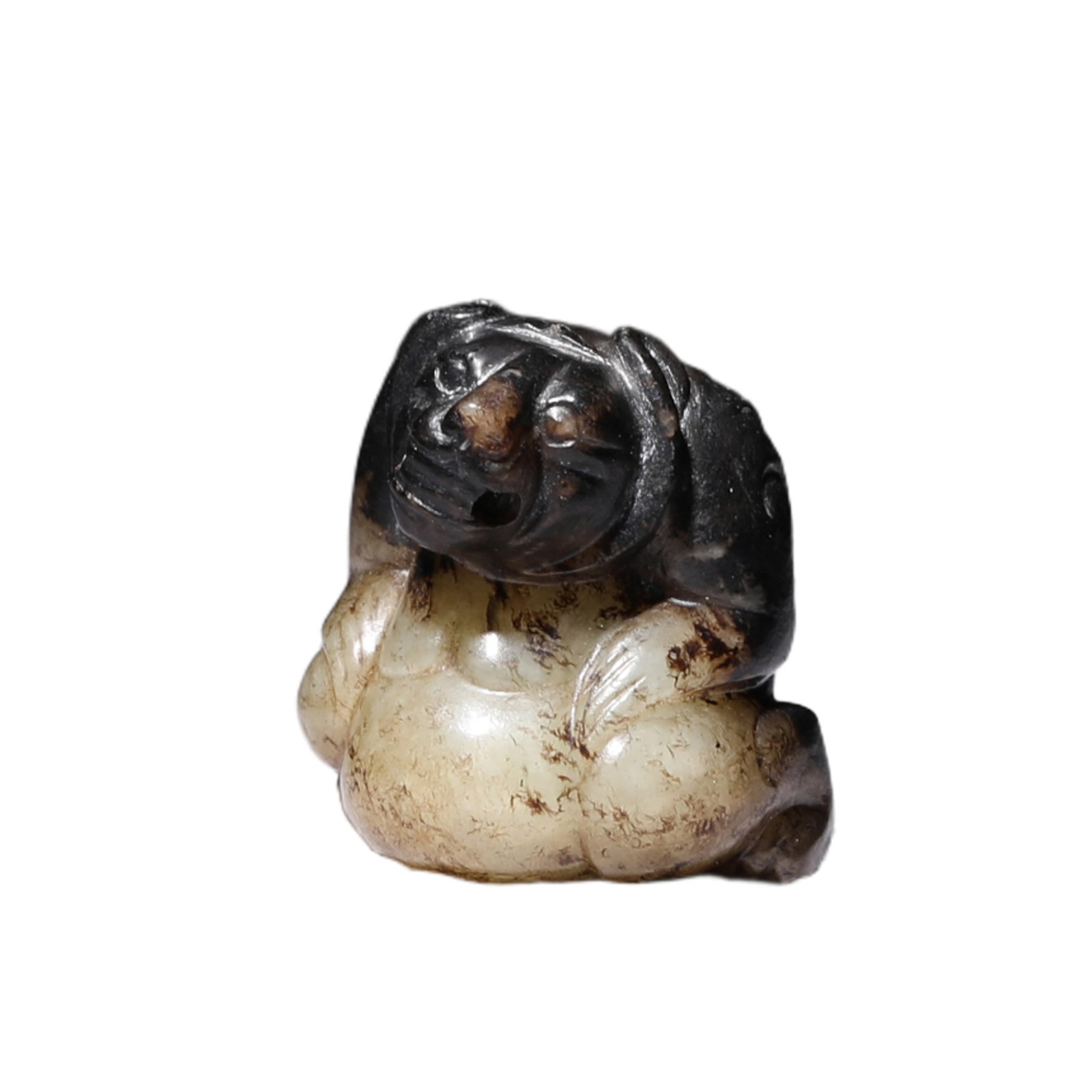 A JADE CARVING OF BEAR: A JADE CARVING OF BEAR The stone is carved in the round as a seated bear with its mouth open to show its fierce fangs, round bulging eyes and large snout. The semi-translucent stone is of a white