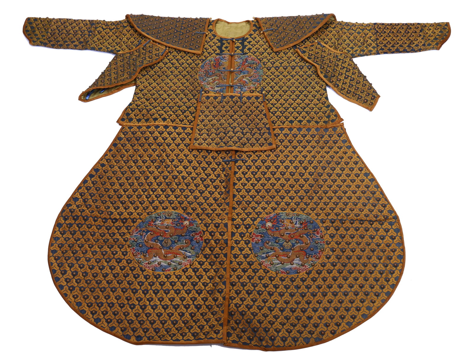 A VERY RARE MANCHU ARCHER'S COSTUME: A VERY RARE MANCHU ARCHER'S COSTUME The short jacket, magua and skirt, qun embroidered with roundels of profile facing five-clawed dragons and flaming pearls, together with underarm pieces, front