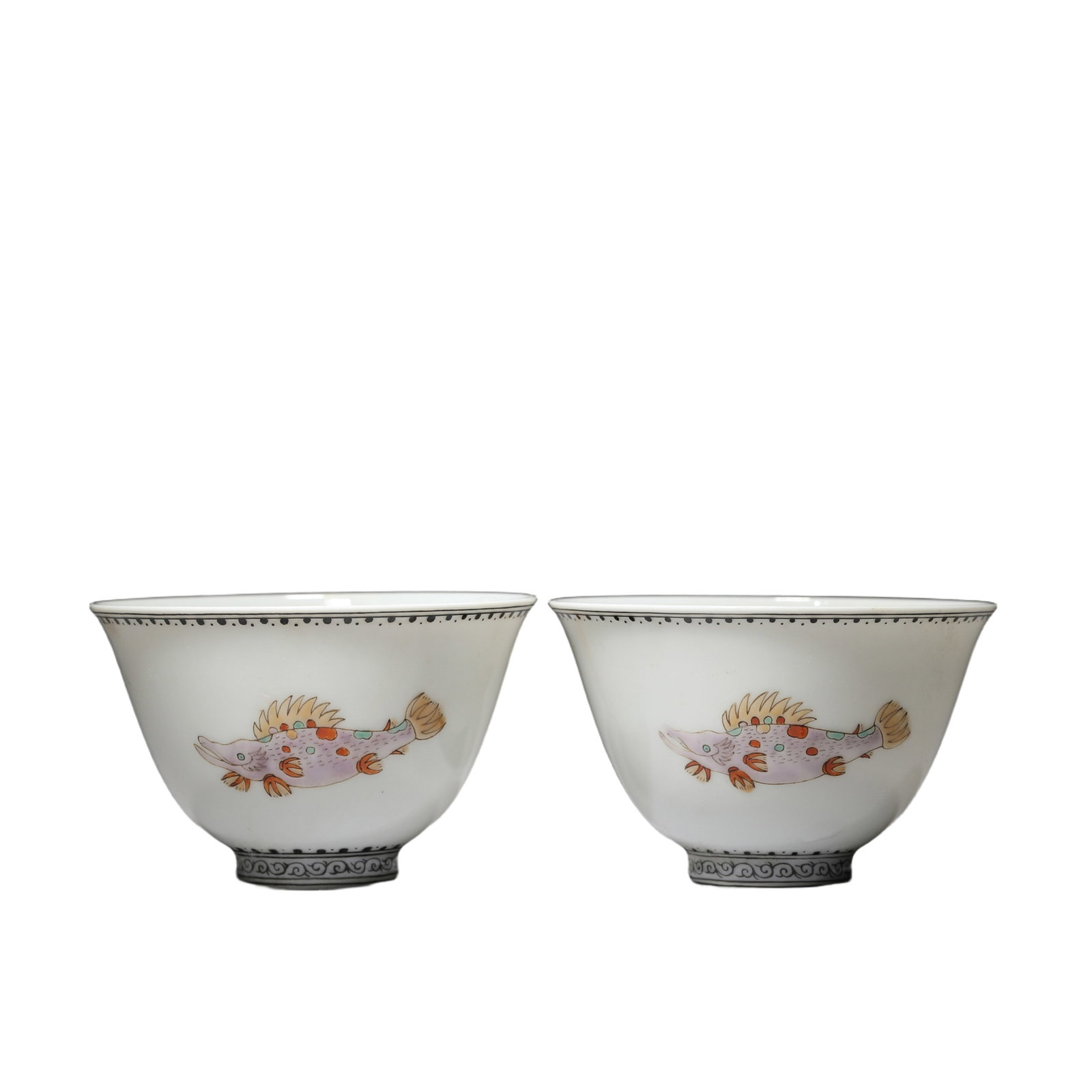 PAIR FAMILLE VERTE BISCUITE FISHES CUPS: PAIR FAMILLE VERTE BISCUITE FISHES CUPS The deep rounded sides rising from a circular foot to a round rim, painted fishes at the exterior. DIMENSION: H:4.3cm; Diam:6.9cm; Two pieces. A LIST OF