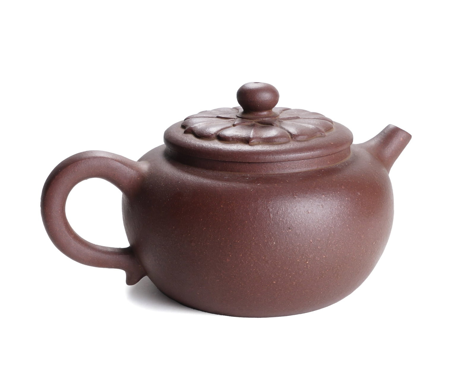 A YIXING GLAZE ZISHA TEAPOT WITH COVER: A YIXING GLAZE ZISHA TEAPOT WITH COVER The compressed globular teapot is carved with a curved, tapering spout and a rounded handle, and the domed cover is surmounted by a plain round finial.
