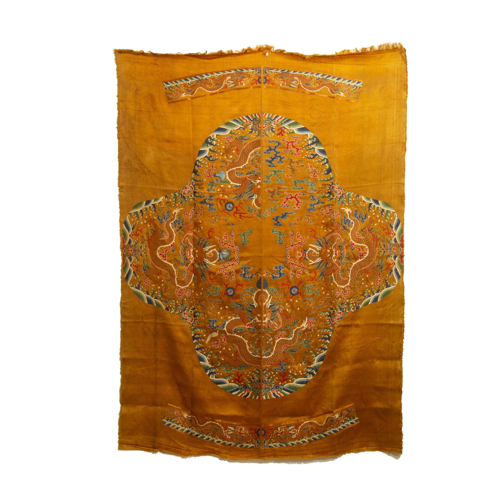 A YELLOW SILK EMBROIDERED UNCUT DRAGON ROBE: A YELLOW SILK EMBROIDERED UNCUT DRAGON ROBE These uncut panels would have later been made up in to dragon robes to be worn on formal court occassions. DIMENSION: L. 178 cm. W. 125 cm. A LIST OF