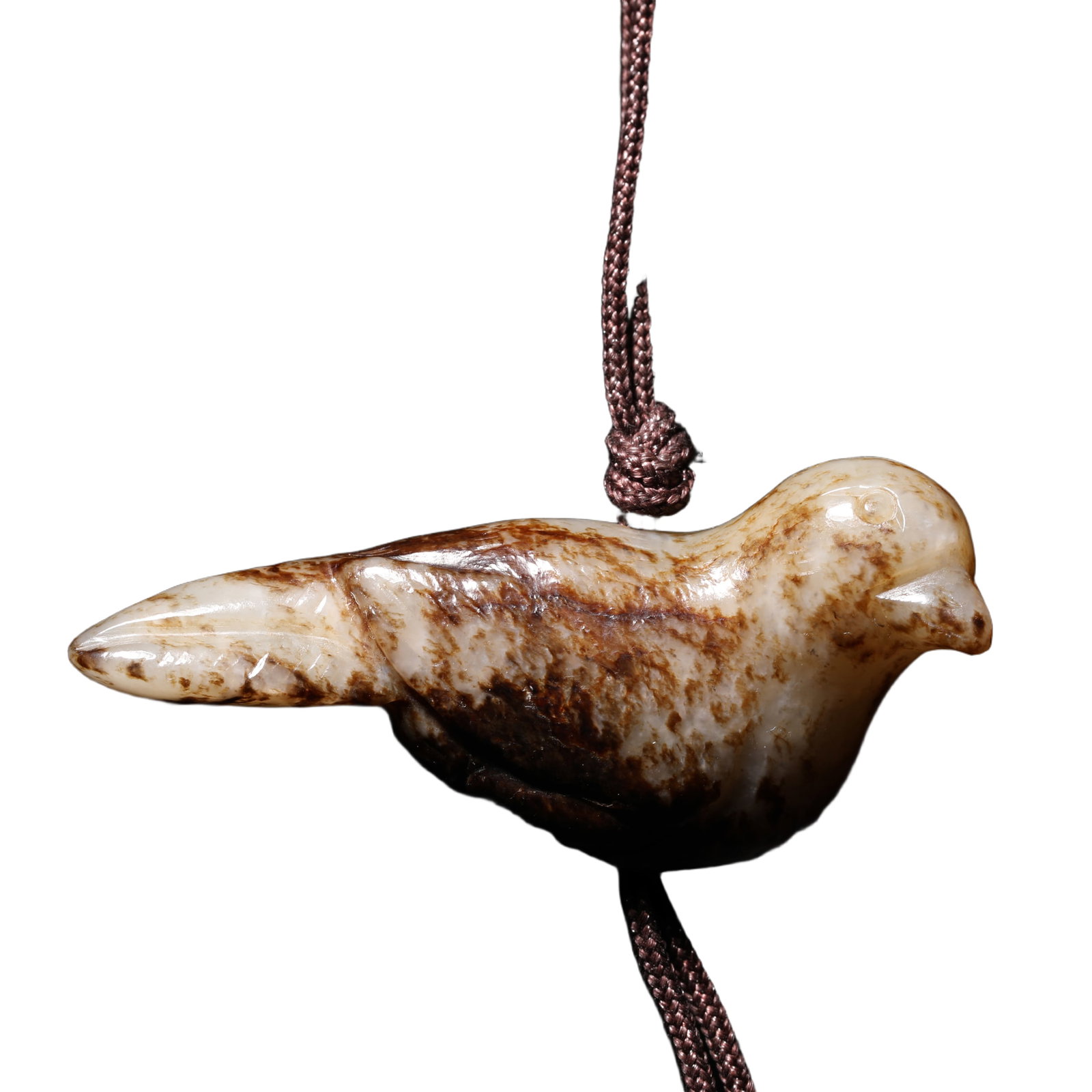 A CARVED JADE BIRD: A CARVED JADE BIRD The bird is shown facing forward with legs carved under the body. DIMENSION: 5.1x1.2x0.6cm A LIST OF RECOMMENDED THIRD-PARTY SHIPPER IS AVAILABLE UNDER SHIPPING INFORMATION. PLEASE