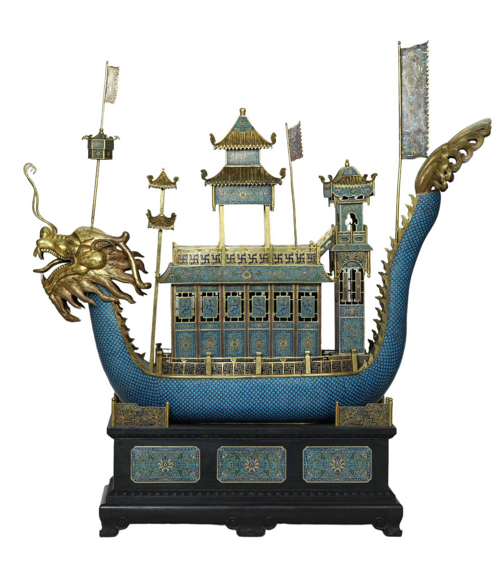 A VERY RARE CLOISONNE ENAMEL DRAGON BOAT: A VERY RARE CLOISONNE ENAMEL DRAGON BOAT Casted scaly dragon floating above stand, the ferocious head with open mouth raised at the prow and long tail bristling with spines curling at the tern,