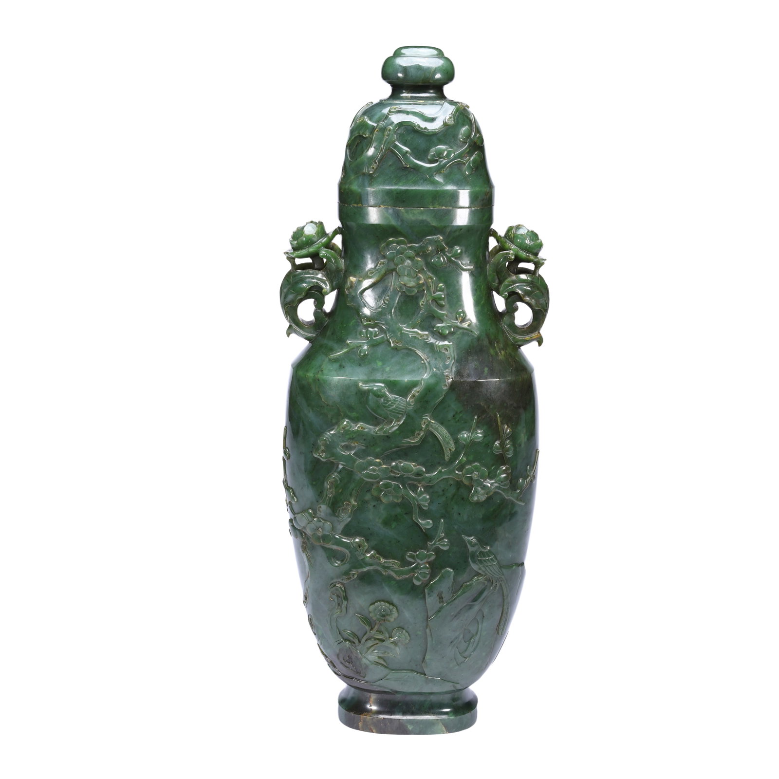 A FINE CARVED SPINACH GREEN JADE VASE WITH COVER: A FINE CARVED SPINACH GREEN JADE VASE WITH COVER Carved as magpies perching on plum blossoms, the stone is of spinach green tone with dark speckles. DIMENSION: L. 42 cm. Weight 3320 grams. A LIST OF