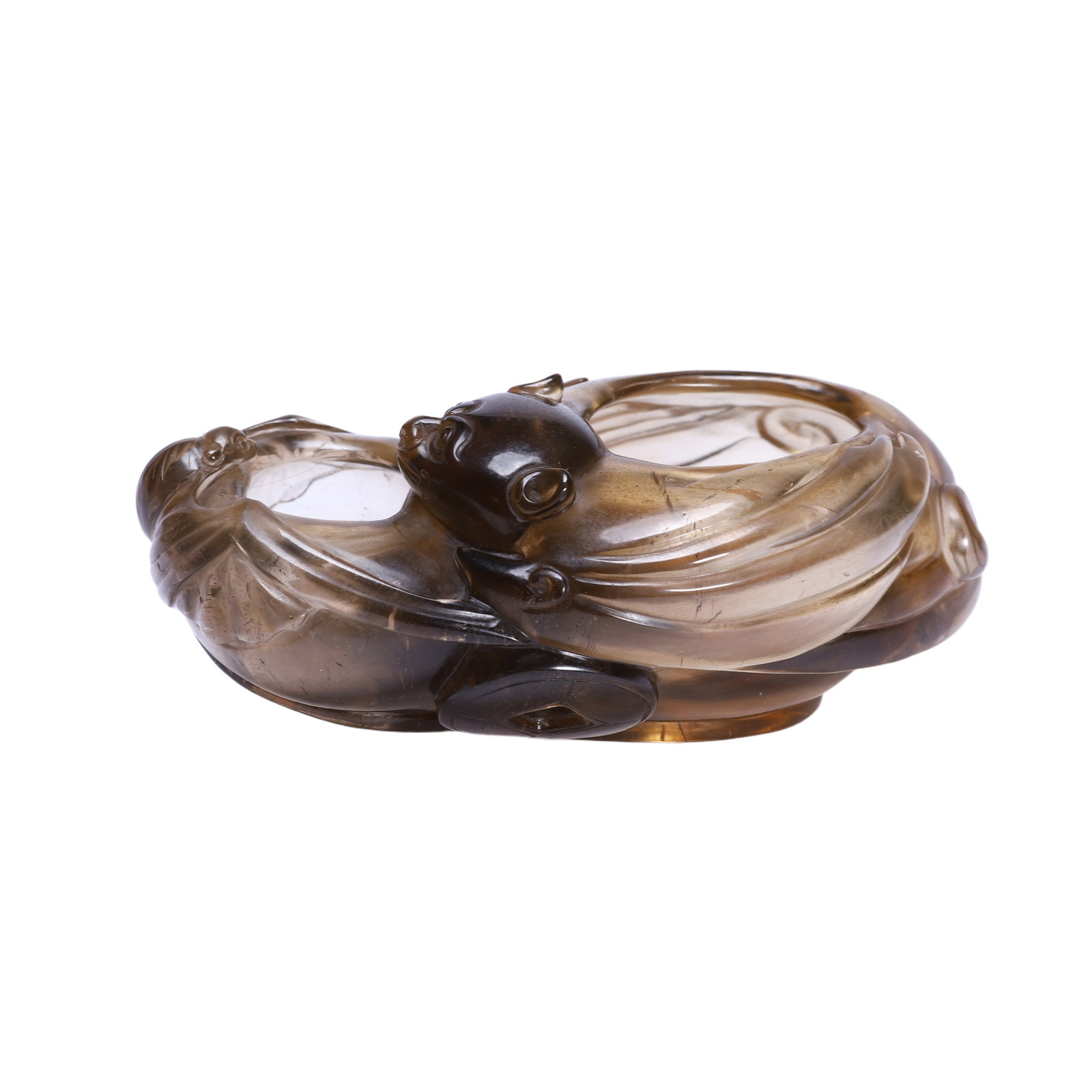 A CARVED SMOKY QUARTZ WASHER: A CARVED SMOKY QUARTZ WASHER Carved as bat form, hollowed inside, the stone is of grayish brown tone. DIMENSION: L. 13 cm. W. 8.5 cm. H. 5 cm. A LIST OF RECOMMENDED THIRD-PARTY SHIPPER IS AVAILABLE