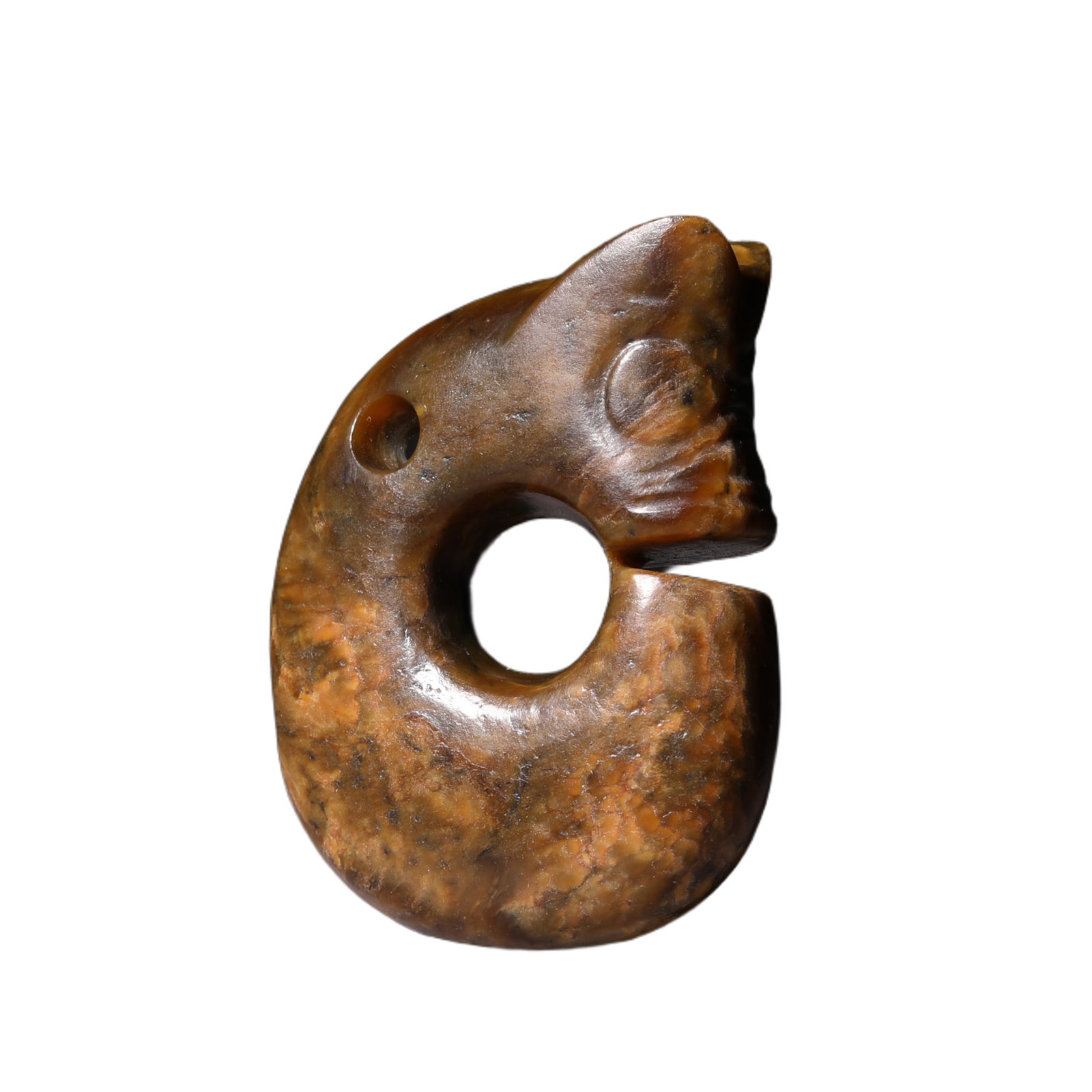 A CARVED JADE PIG-DRAGON: A CARVED JADE PIG-DRAGON Of typical 'C' shape with an arched body extending to a pointed tip at the tail, its head detailed with bulging eyes, upturned snout and an undulating crest. DIMENSION: 6.1x4.