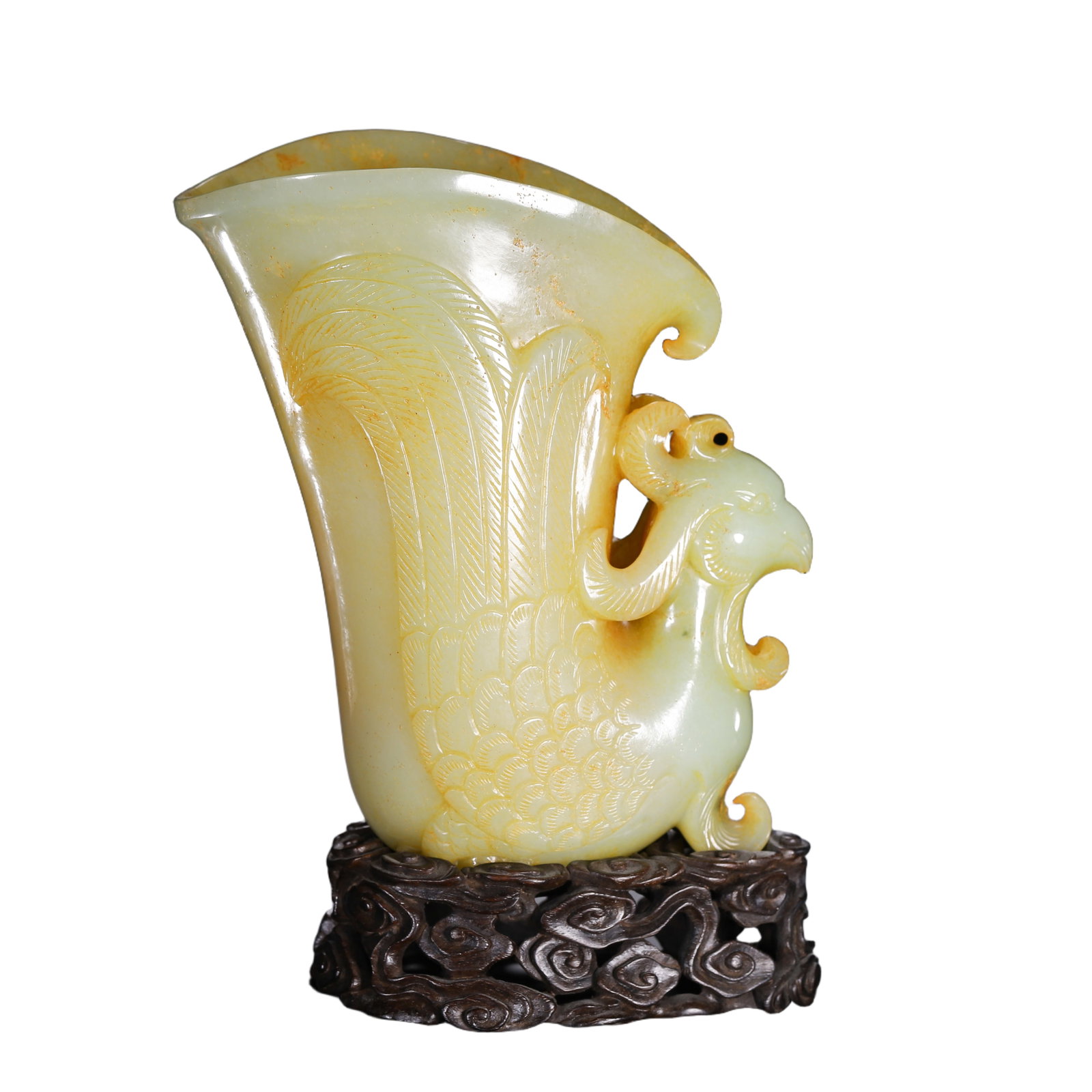 A CARVED YELLOW JADE PHOENIX CUP: A CARVED YELLOW JADE PHOENIX CUP Based on Qing court archival records, Emperor Qianlong had exacting aesthetic standards in relation to scholar items made of yellow jade. He preferred a plain elegant 