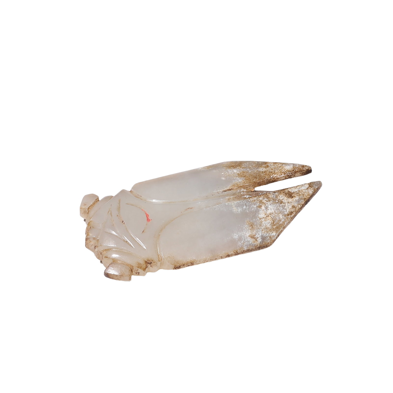 A CARVED WHITE JADE CICADA: A CARVED WHITE JADE CICADA The cicada is carved to the top with crisp grooves to delineate the head, pronounced eyes and wings, while the underside is decoratedwith fine lines to depict the ribbed abd