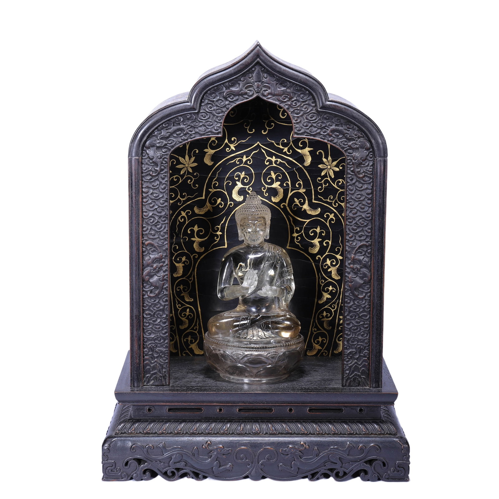 A CARVED ROCK CRYSTAL BUDDHA WITH ROSEWOOD ZITAN SHRINE: A CARVED ROCK CRYSTAL BUDDHA WITH ROSEWOOD ZITAN SHRINE His hair is swept back into a topknot, and long plaits cascade down the shoulders. The face has downcast eyes and a serene expression. A shawl