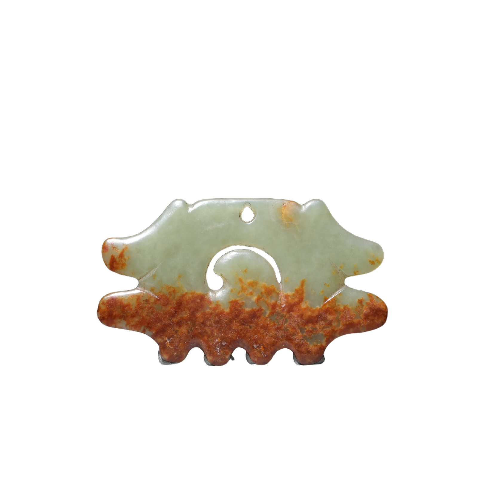 A JADE CARVING OF ORNAMENT HONGSHAN CULTURE: A JADE CARVING OF ORNAMENT HONGSHAN CULTURE The well-polished stone is carved and pierced in the form of an animal mask. DIMENSION: 9.5x5.5x0.5cm A LIST OF RECOMMENDED THIRD-PARTY SHIPPER IS AVAILABLE