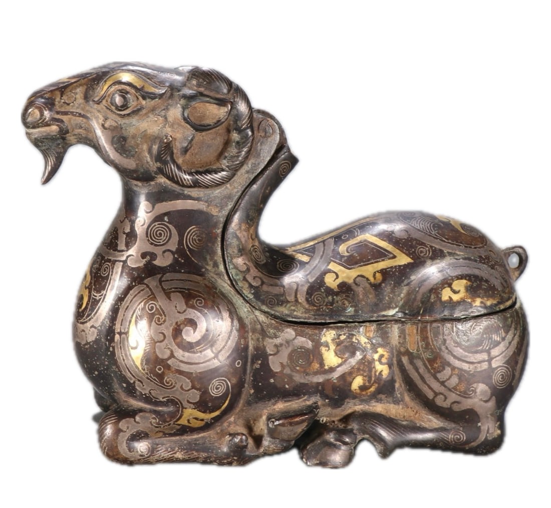 A CHINESE GOLD AND SILVER INLAYS BRONZE SHEEP: A CHINESE GOLD AND SILVER INLAYS BRONZE SHEEP DIMENSION: H. 10 cm.W 12.7 CM. A LIST OF RECOMMENDED THIRD-PARTY SHIPPER IS AVAILABLE UNDER SHIPPING INFORMATION. PLEASE FEEL FREE TO CONTACT THEM FOR A Q