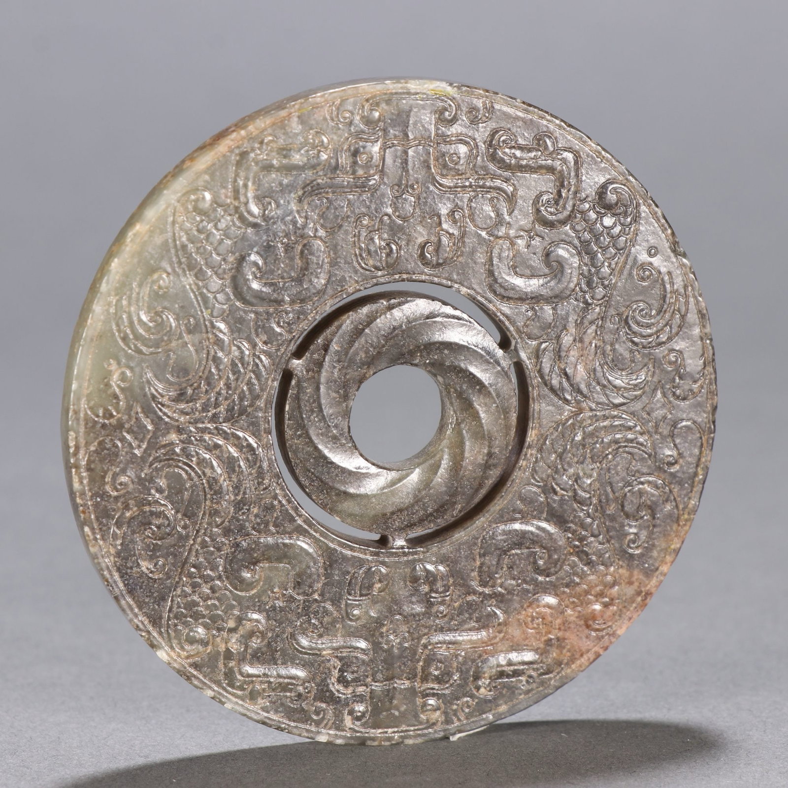 A CHINESE CARVED DRAGON JADE BI DISC: A CHINESE CARVED DRAGON JADE BI DISC DIMENSION: D 7.3 CM. A LIST OF RECOMMENDED THIRD-PARTY SHIPPER IS AVAILABLE UNDER SHIPPING INFORMATION. PLEASE FEEL FREE TO CONTACT THEM FOR A QUOTE.
