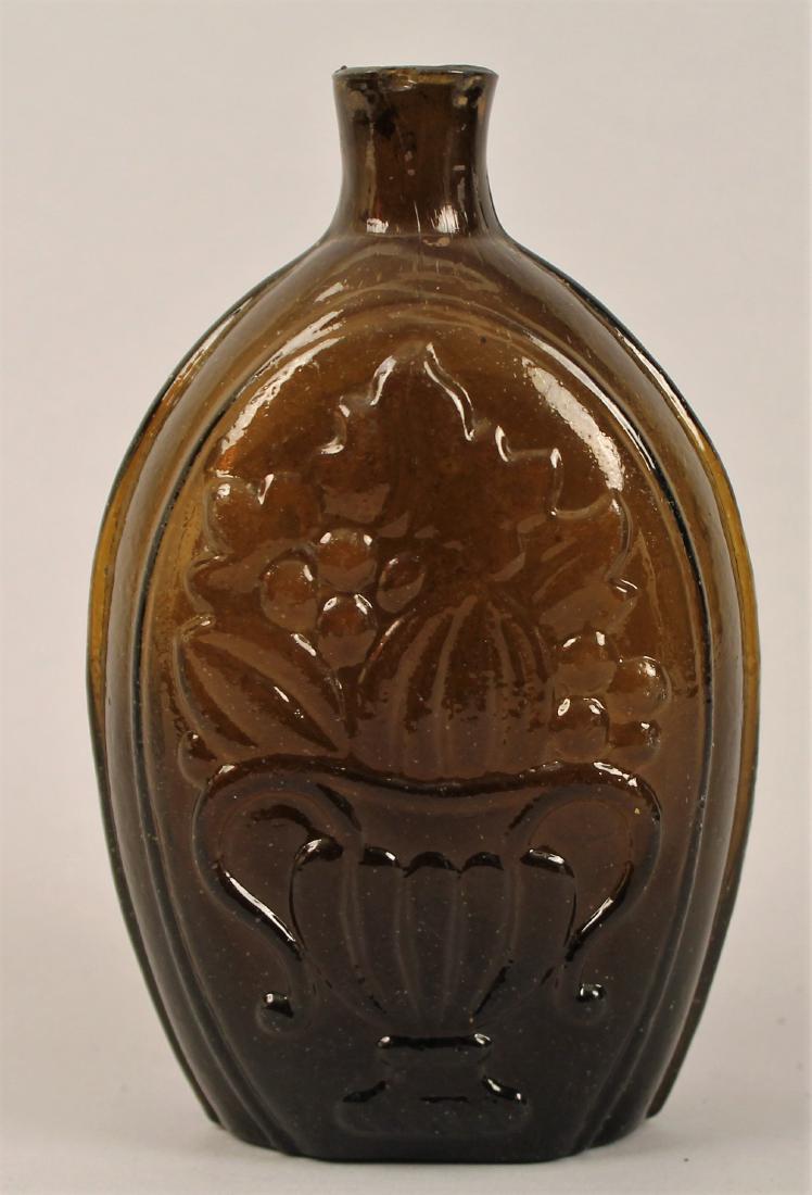 Cornucopia Flask Bottle: 18th century cornucopia flask bottle. 6 3/4" tall.