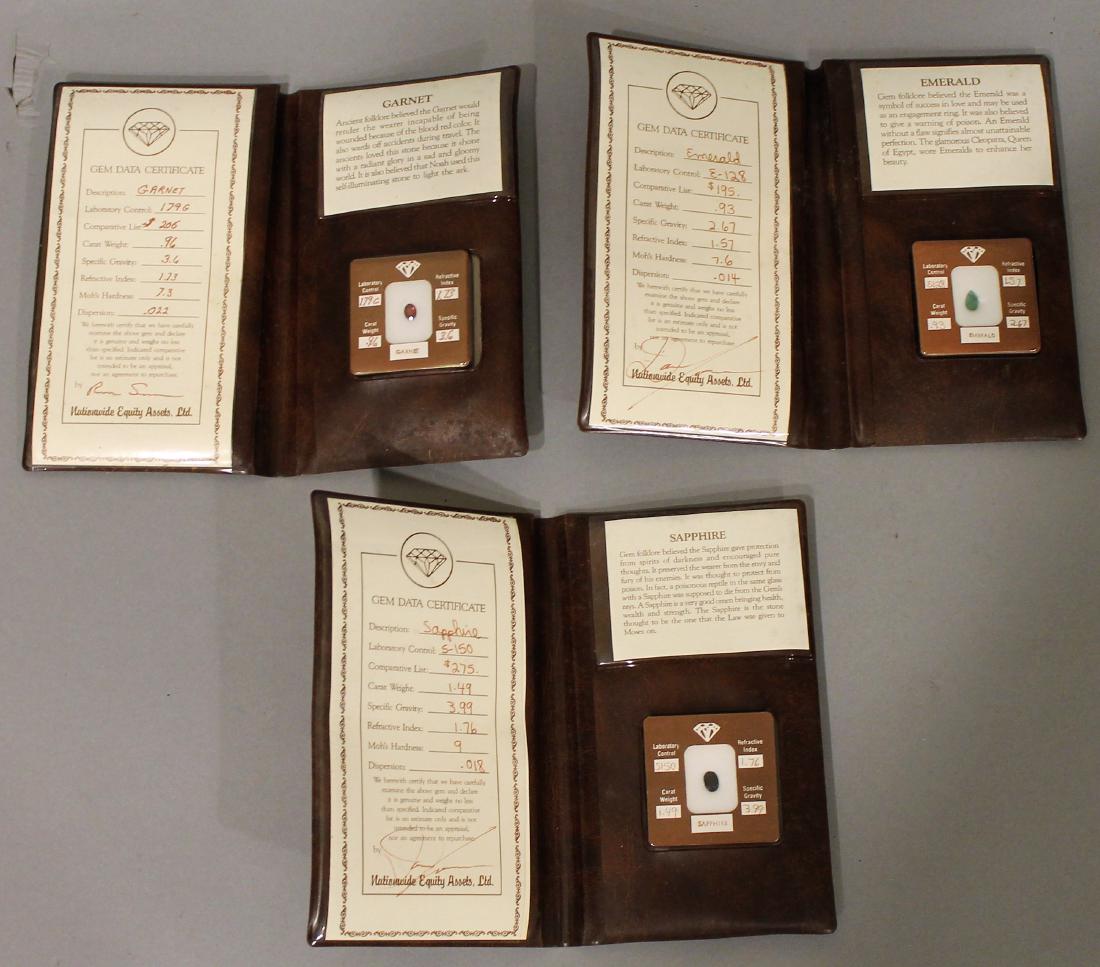 Emerald, Saphire & Garnet Gem Samples: 3 cased gem samples with certificates. Emerald, Saphire & Garnet. Shipping available within the continental United States (excludes insurance) for $25. International buyers are responsible for arrangi