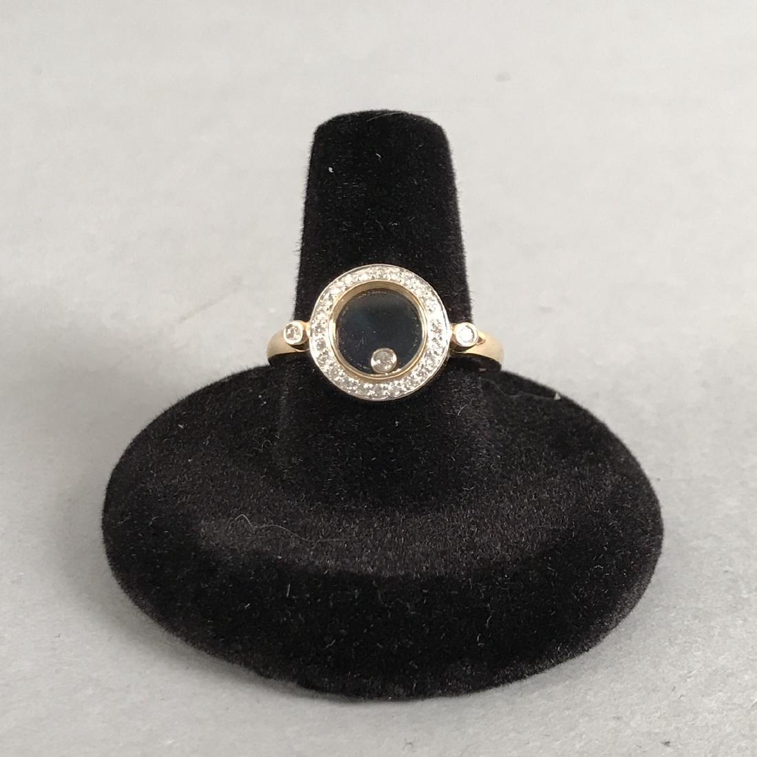 14K Gold and Diamond Samuel Behnam Ring: Samuel Behnam 14KT gold and diamond ring. Circle of tiny set diamonds surrounding a single floating diamond set in gold between two glass windows. Marked 14KT and SBC. Size 9. Gross weight 5.2g. Shipp