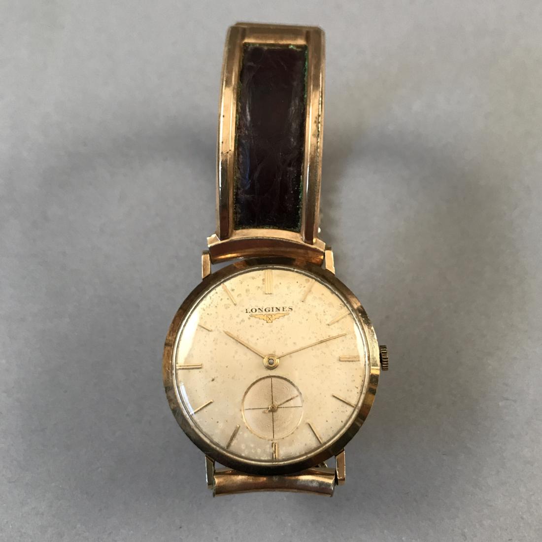14K Gold Longines Wristwatch: 14K Gold Longines wristwatch. Marked 14K on the watch case. With Kreisler Band. Shipping available within the continental United States (excludes insurance) for $25. International buyers are responsib