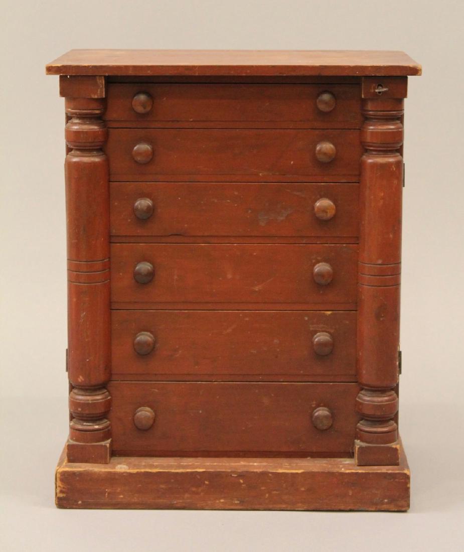 19th C Mulit Drawer Miniature Lock Side Chest: Six drawer miniature chest with finely dovetailed construction. Two half columns, one with a lock and key. 18 1/2"H x 15"W x 9 3/4"D