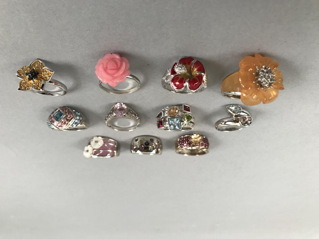 11 Sterling Silver Rings Many w/ Gemstones: Lot of 11 Sterling Silver Rings, Many with Gemstones. All are marked either 925 or Sterling. Gross weight 85.4g. Shipping available within the continental United States (excludes insurance) for $25. I