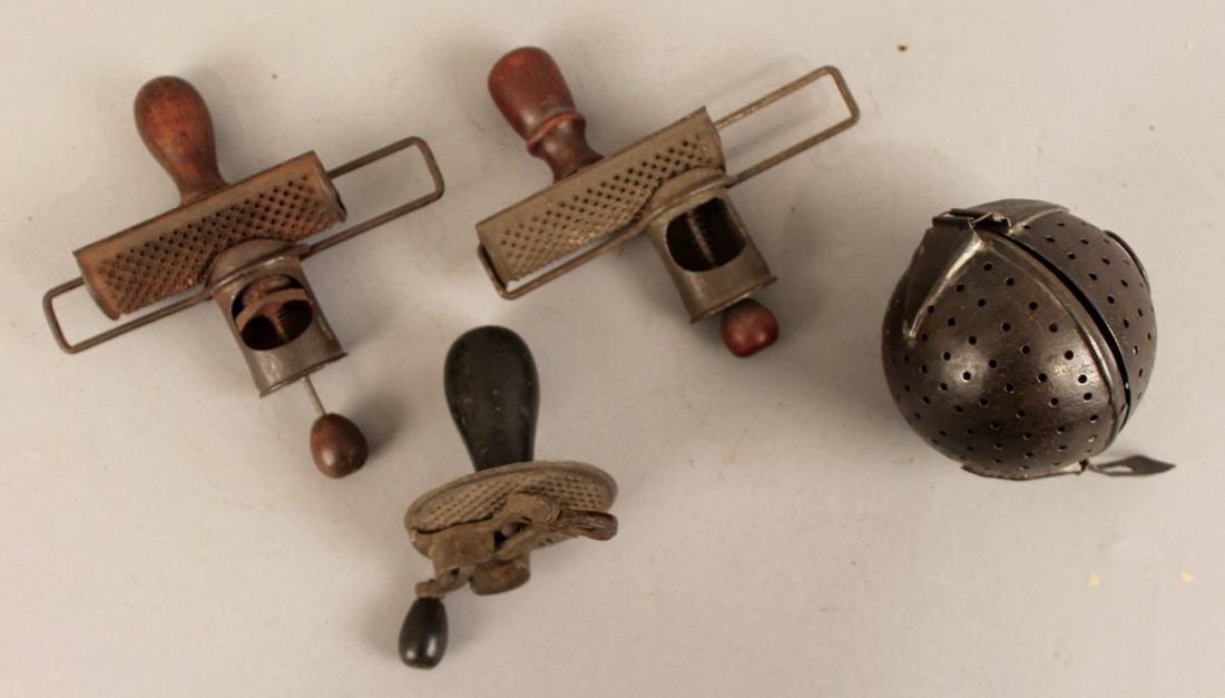 4 Pcs Metalware Nutmeg Graters & Giant Tea Ball: 3 nutmeg graters with wooden handles and large metal tea ball.