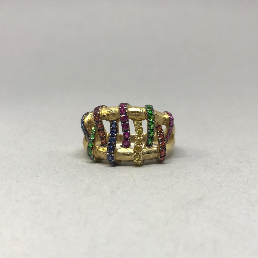 14K Gold Ring with Assorted Gemstones: 14Kt Gold Ring with florentine finish and assorted gemstones set to look like they are woven together. Amethyst, Alexandrite, Chromdiopside, Cognac Topaz, Citrine. Size 9. 6.9g