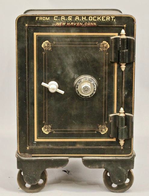 York Safe & Lock Company Safe: Cast Iron Safe on Wheels in Original Painted Finish from New Haven, CT. York Safe & Lock Company. 26" T x 17 W x 19 D (combination available to buyer)