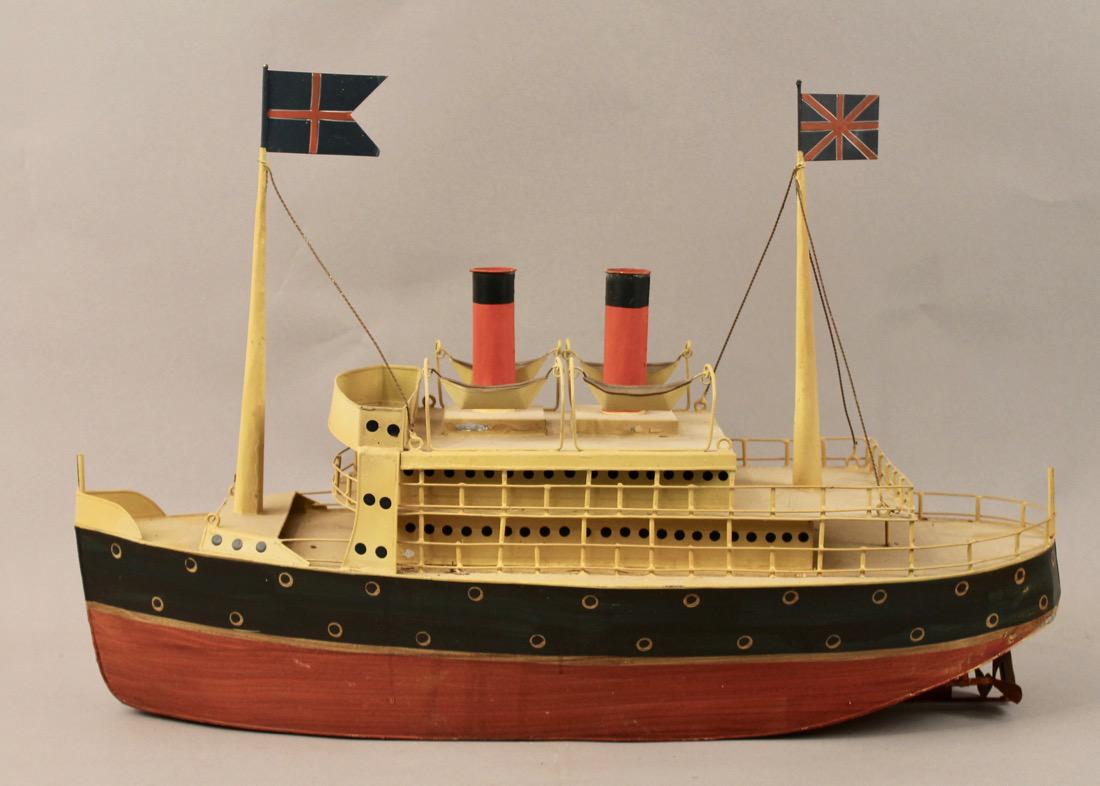 Tin British Cruise Ship Model: Tin British Cruise Ship Model in original painted finish. 26" L x 16" T