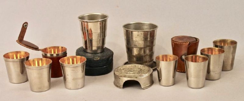 4 Traveling / Folding Cups: Two sets of 4 cups in leather cases. Hot springs folding cup. Folding cup in leather case.