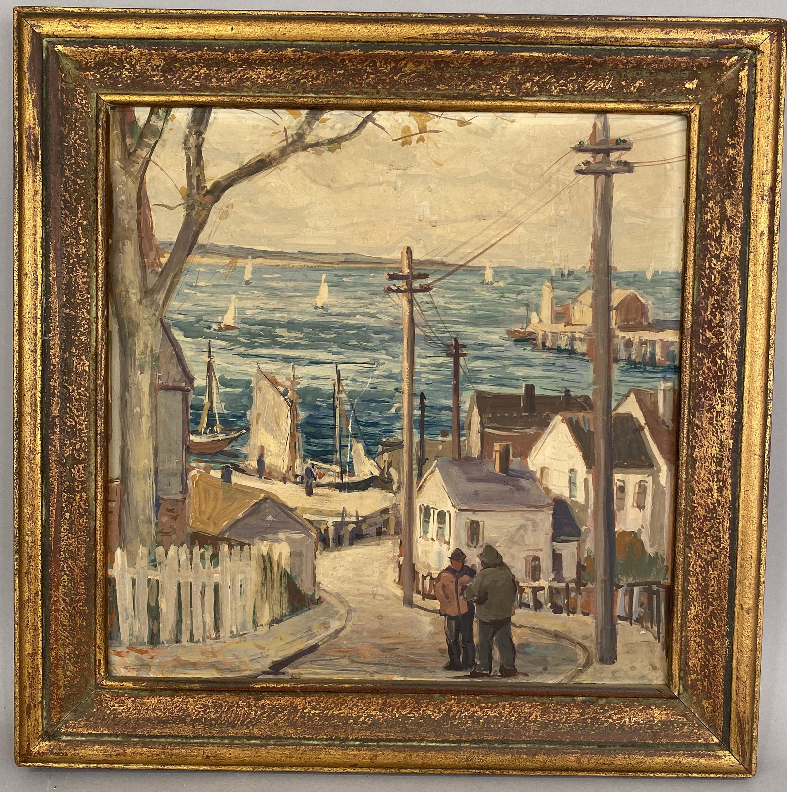Harvey Gordon Waterfront Village Street Scene O/C: Painting of two people talking in the street of a waterfront village, water in the background.Oil on Board, signed verso in pencil, Harvey Gordon with inscription that reads "down by the sea October."