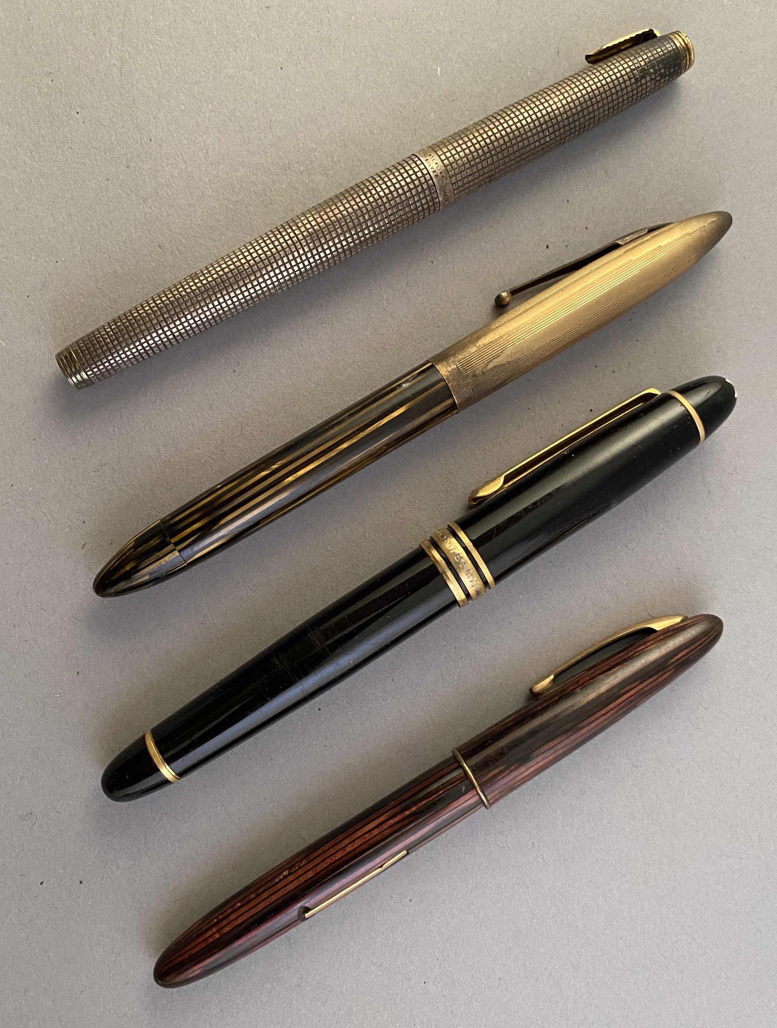 3 Fountain Pens and 1 ballpoint, Montblanc, Scheaffer's: 3 fountain pens and 1 ballpoint pen including Montblanc Meisterstuck, Scheaffer's, Sterling Silver Parker with 18K Gold top and Scheaffer with 14k tip. Provenance Estate of Howard A Legge.