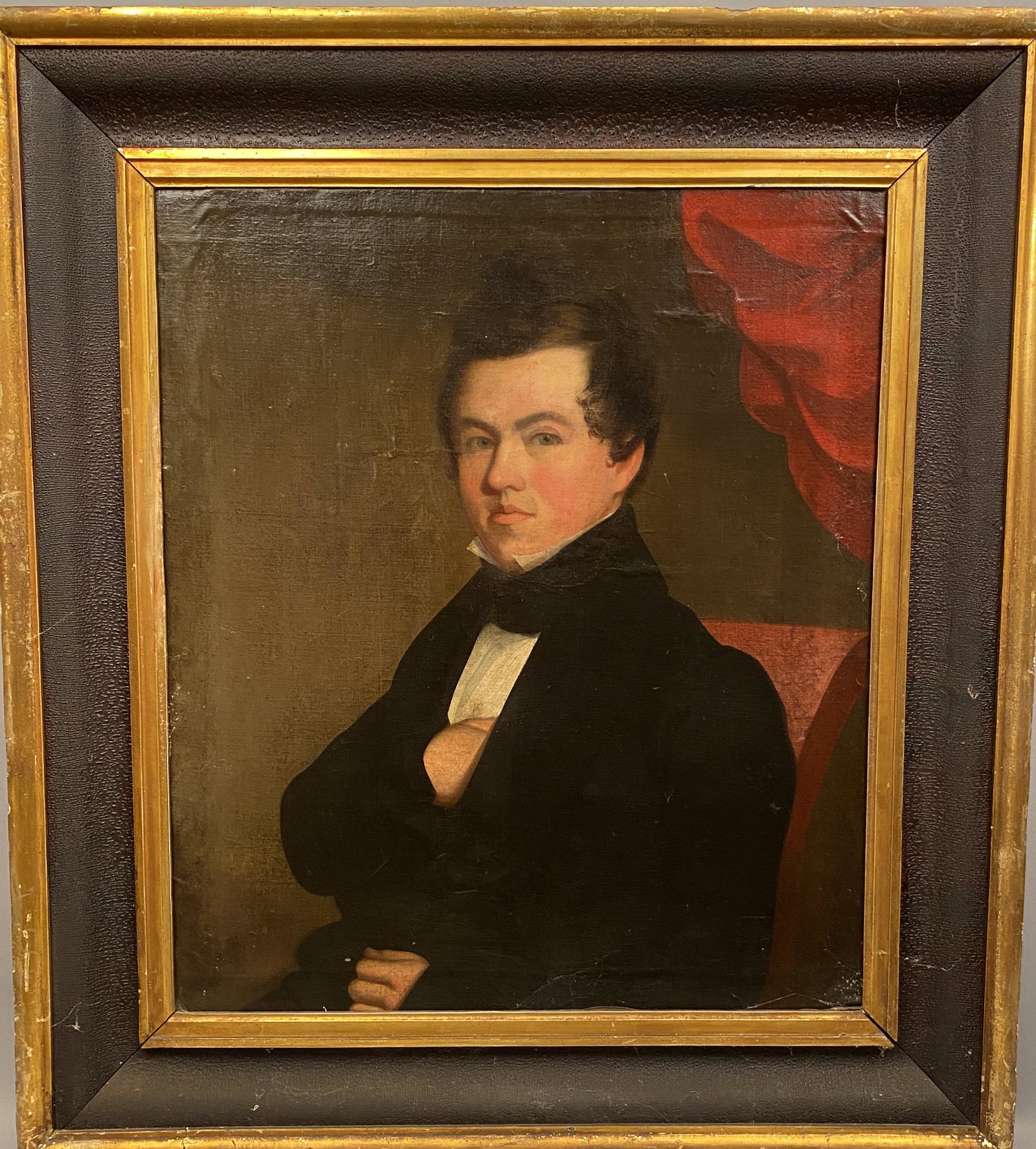 Portrait of a Gentleman English School: Portrait of a gentleman seated in a red chair with his hand in his vest and a red curtain in the background. Sight 29 3/4" x 26"