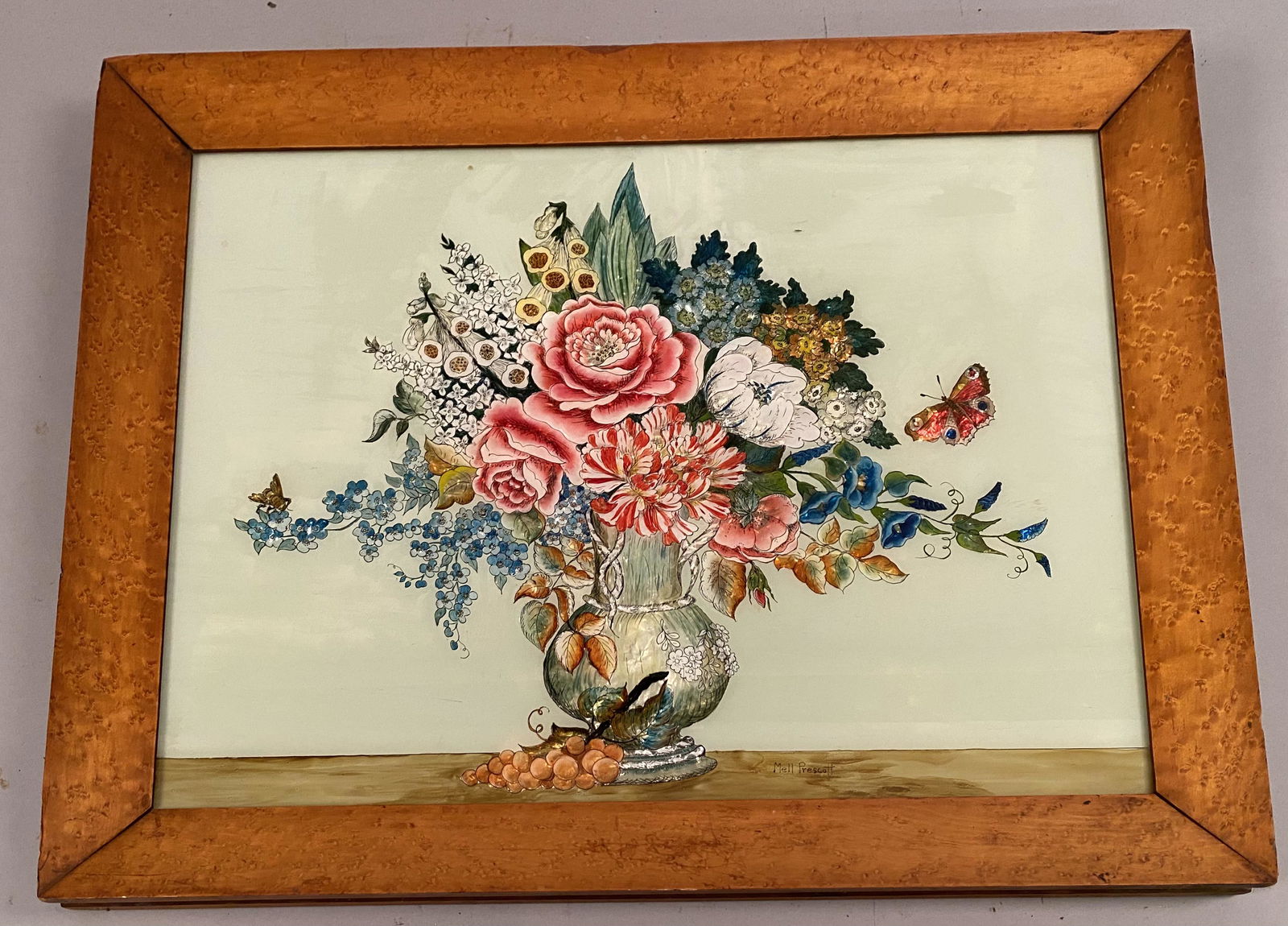 Mell Prescott Reverse Painting on Glass of Flowers: Mell Prescott reverse painting on glass of flowers in a footed vase, in original birdseye maple frame. Foil highlighted backdrop, vibrantly painted vase and flowers with a butterfly and bee. Frame 24�