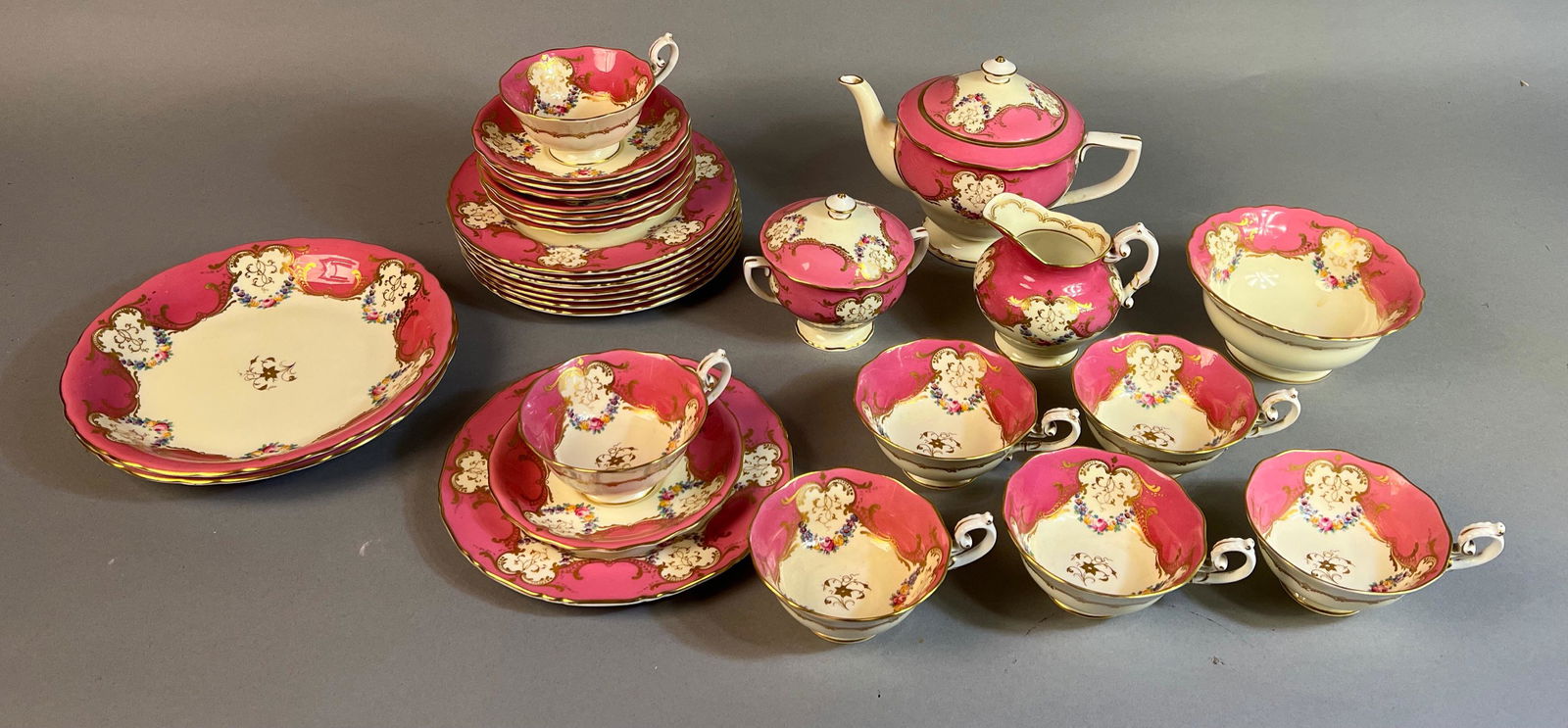 Royal Worcester Bone China Luncheon Set: Royal Worcester bone china luncheon set including 8 12Ó plates, eight saucers, 7 cups, two 9 inch serving dishes, one small serving bowl, a tea pot and sugar and creamer.