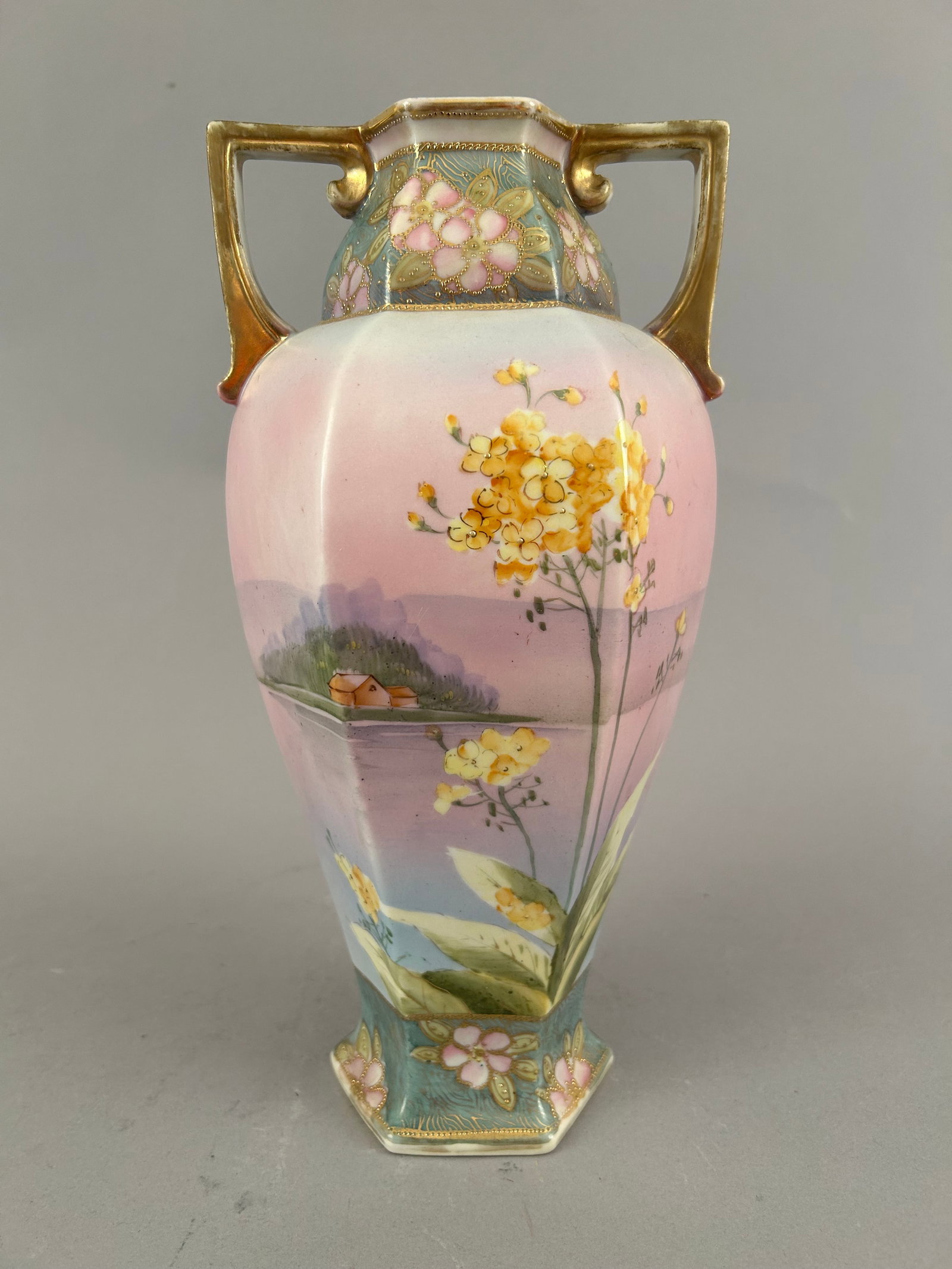 Handpainted Nippon Two Handled Vase Pink Twilight Scene: Handpainted Nippon two handled vase predominantly pink with a beautiful twilight scene with yellow flowers.