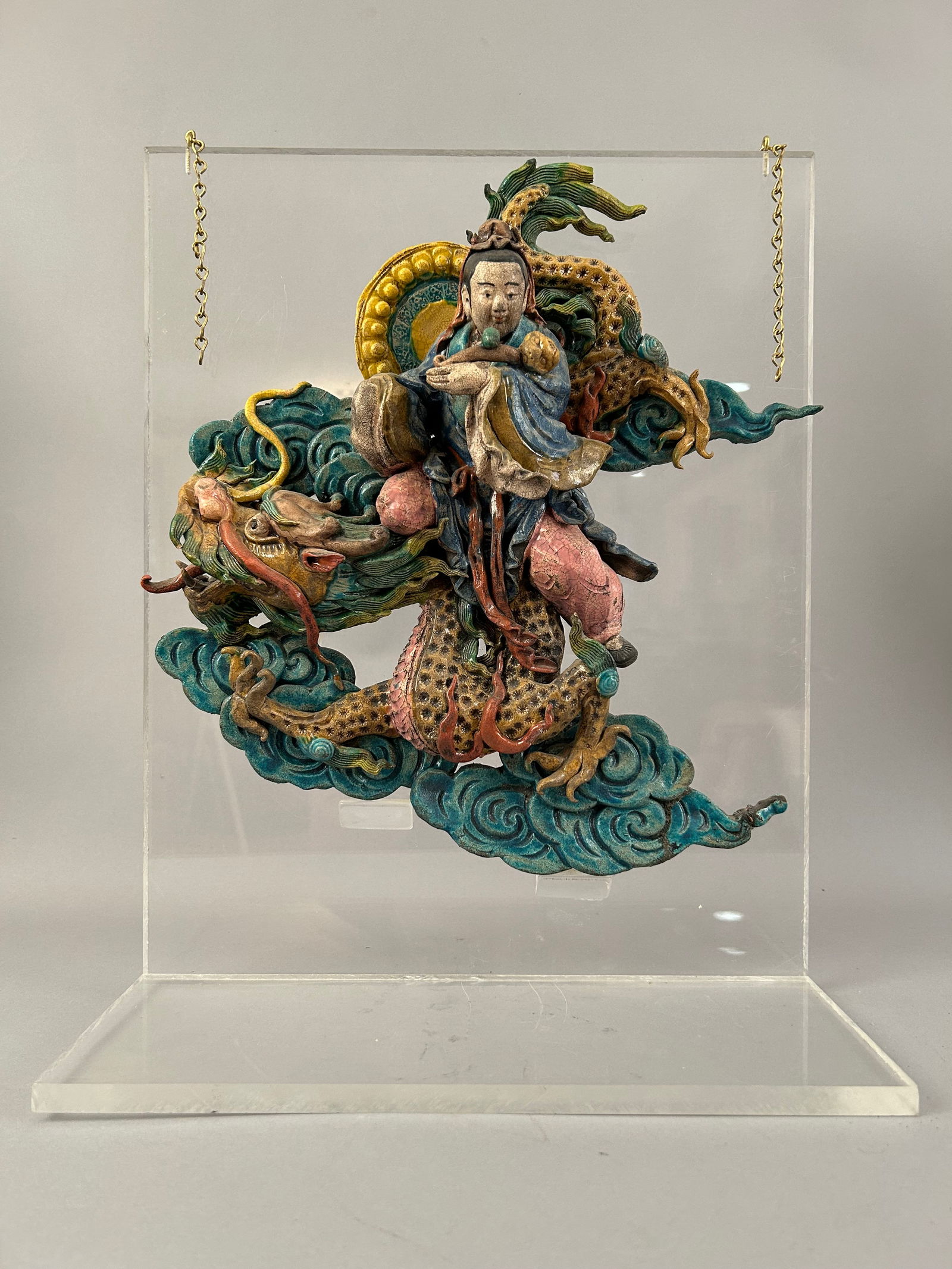 Chinese Roof Tile Of A Man Riding A Dragon: Chinese roof tile of a man riding a dragon. Mounted on acrylic.