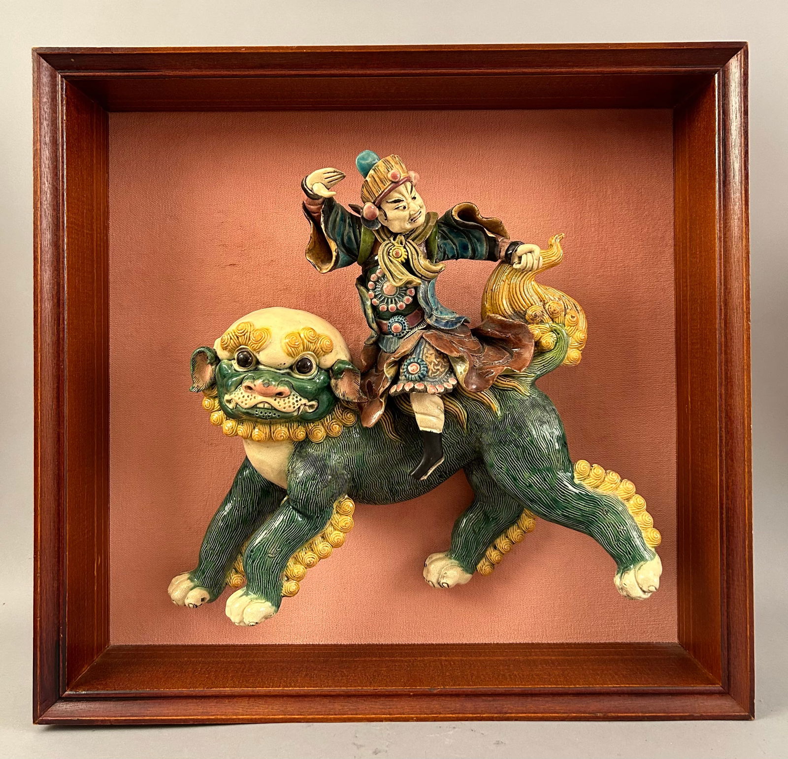 Chinese Roof Tile Of A Warrior Riding A Foo Dog: Chinese roof tile of a warrior riding a foo dog. Mounted in a shadow box.