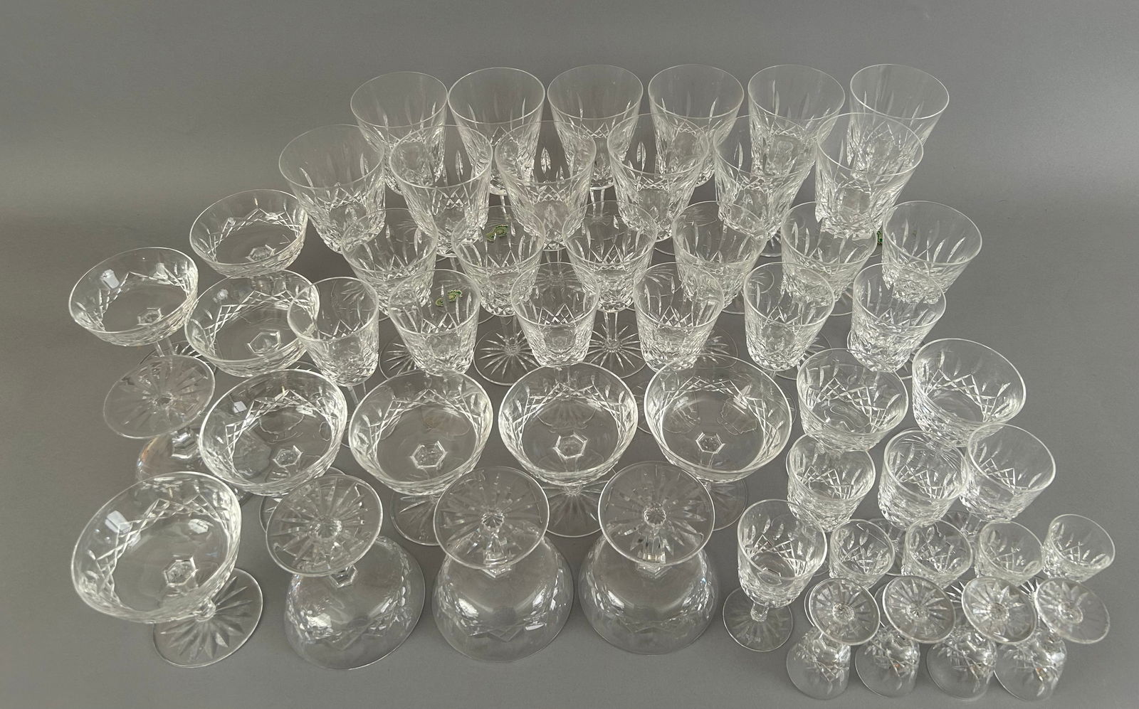 50 Pieces Of Waterford Crystal Stemware: 50 pieces of Waterford Crystal stemware in assorted shapes and sizes.