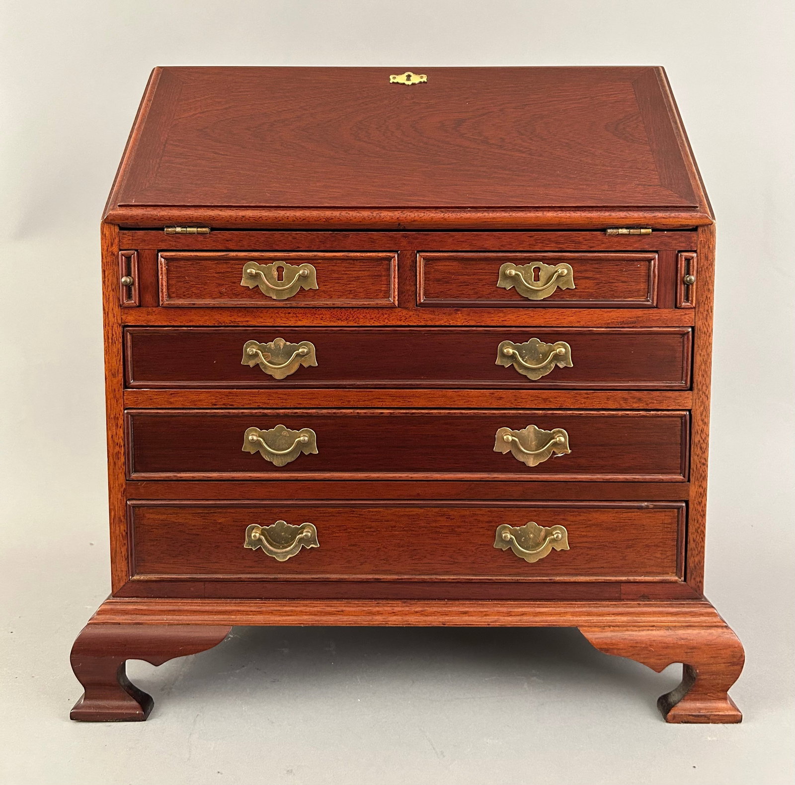Miniature Wooden Slant Front Desk: Miniature wooden slant front desk.