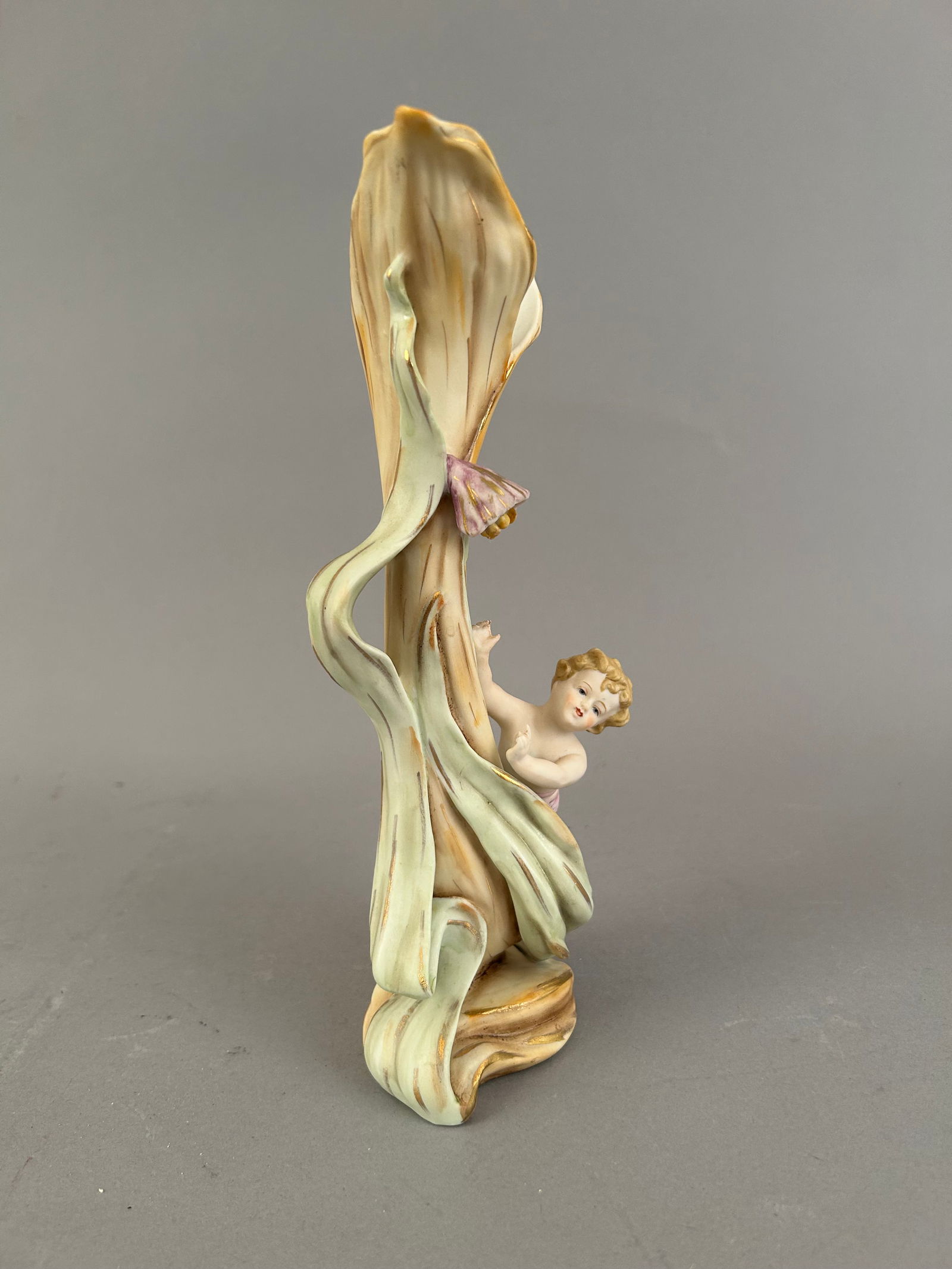 Bisque Porcelain Figural Vase: Bisque porcelain figural vase with a child and a flower.Ê