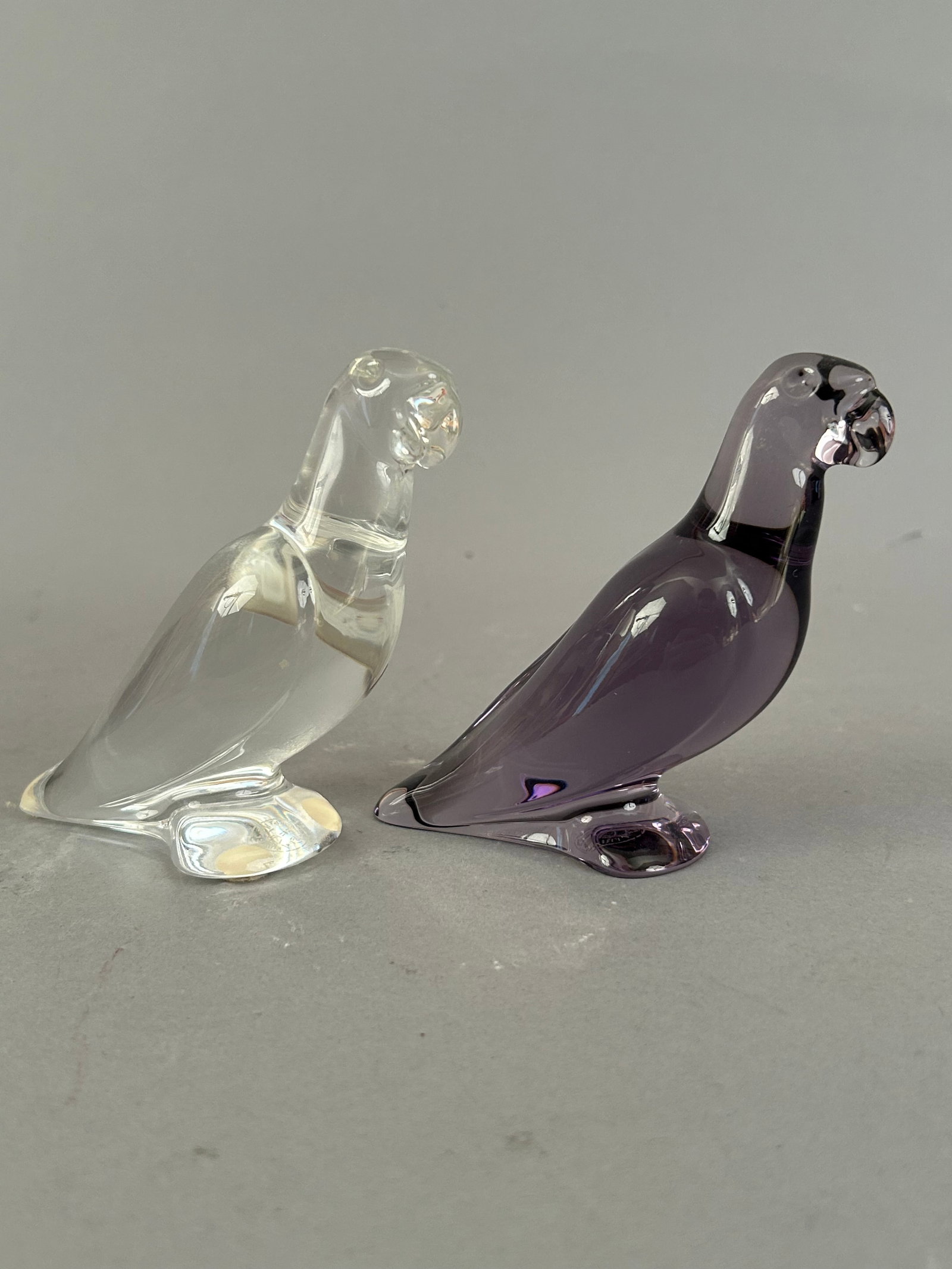 Pair Of Baccarat Birds, One Clear One Purple: Pair of Baccarat birds, one clear one purple. Both signed.