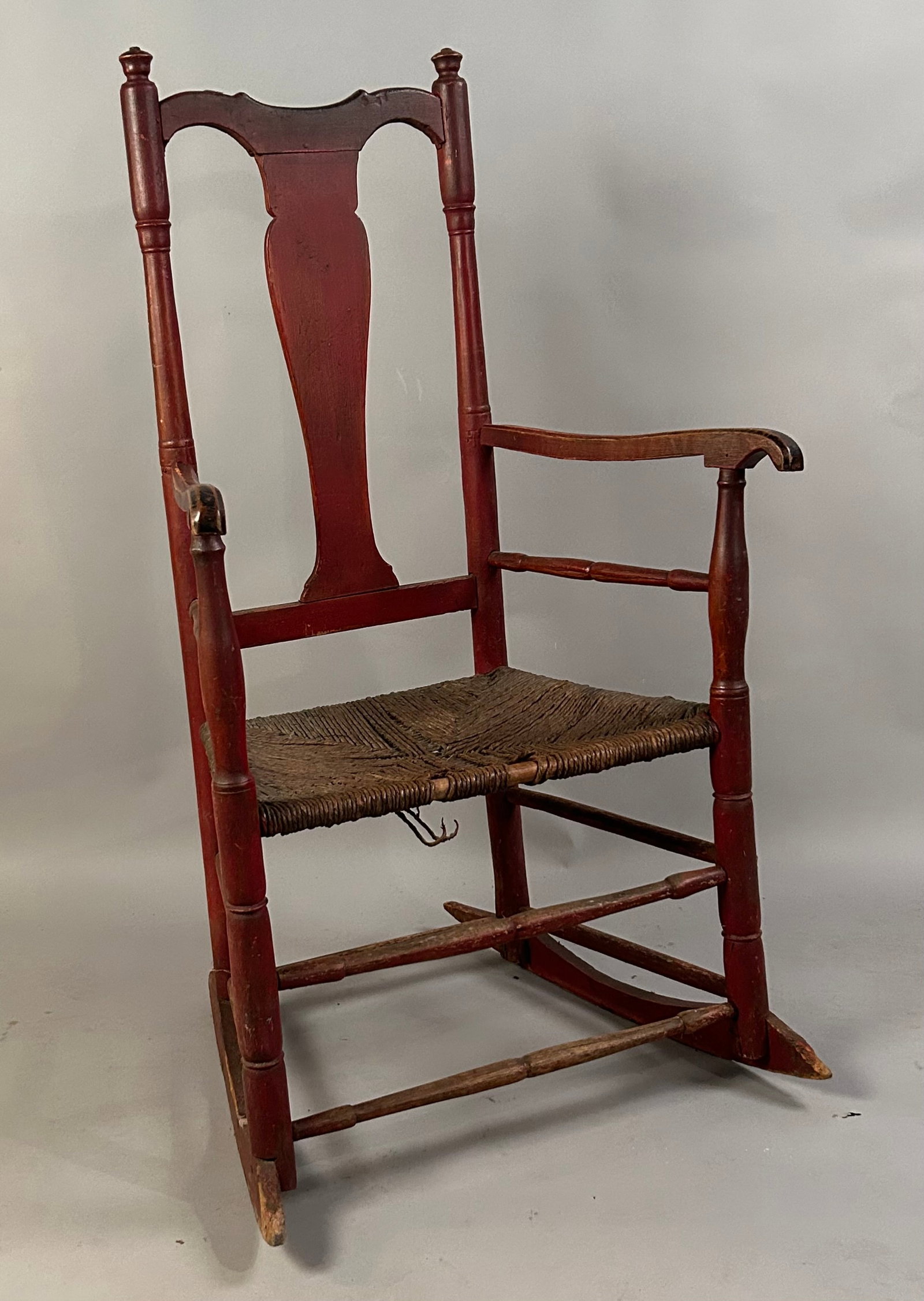 Rocking Chair with Red Paint: Rocking chair with red paint and rushed seat. Some damage to seat. Seat height 16.5"