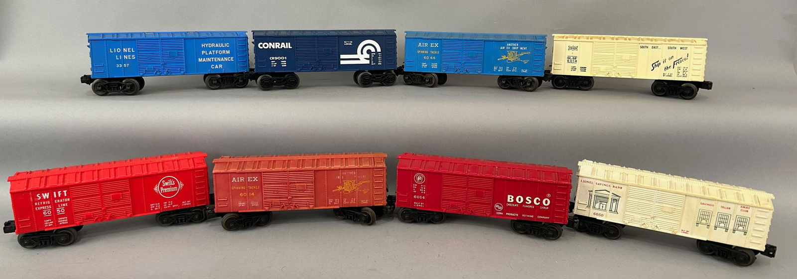 Eight Lionel Boxcars O Gauge: Eight Lionel Boxcars Including 6050 Swift Refrigerator Express Line Box Car, 6014 Airex Boxcar, 6014 Bosco, 6050 Savings Bank Box Car, 3357 Hydraulic Platform Maintenance Car, CR9001 Conrail Boxcar, 6