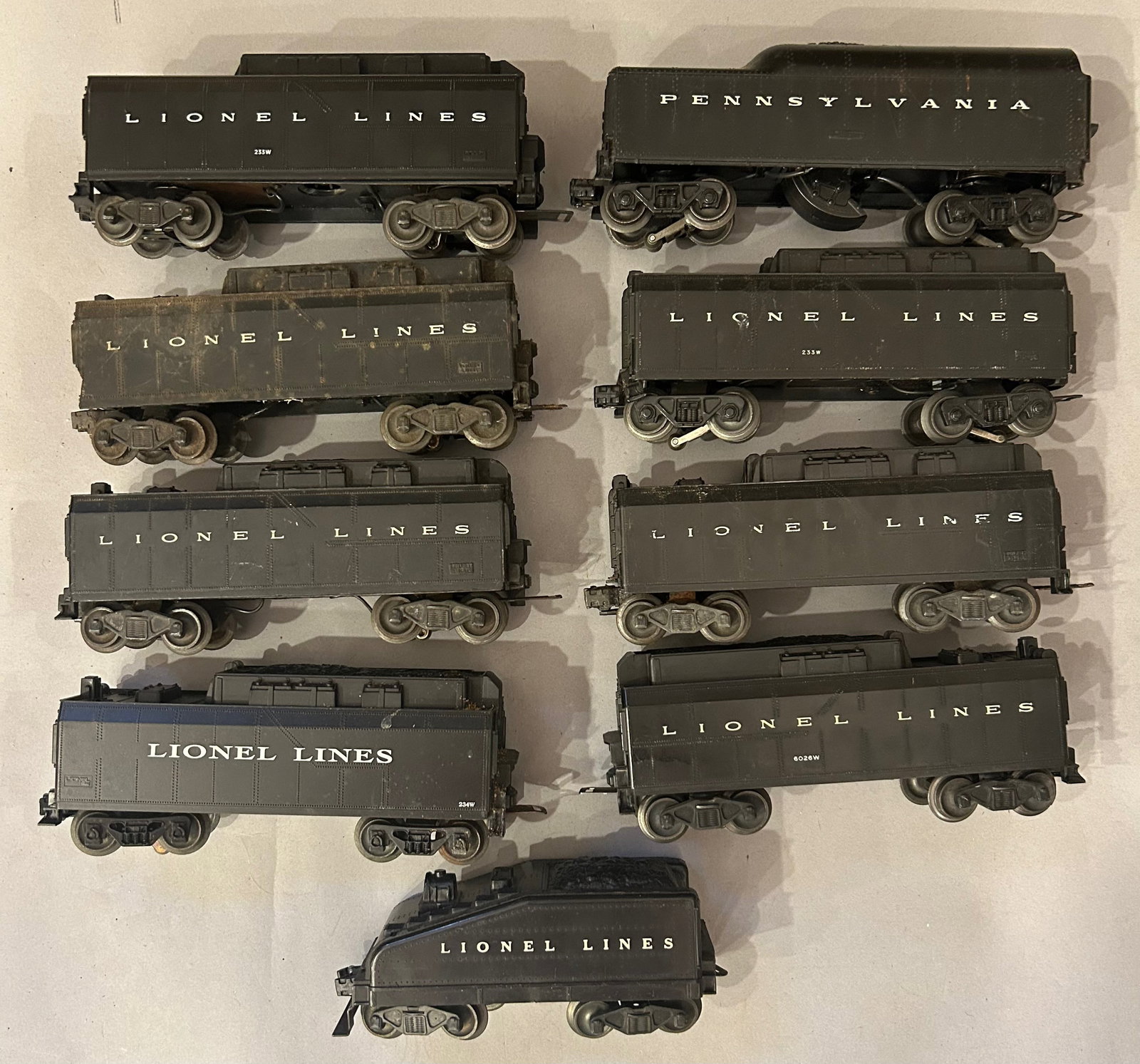 Nine assorted Lionel Lines Coal Car Tenders O Gauge: Nine assorted Lionel Lines Coal Car Tenders. O Gauge