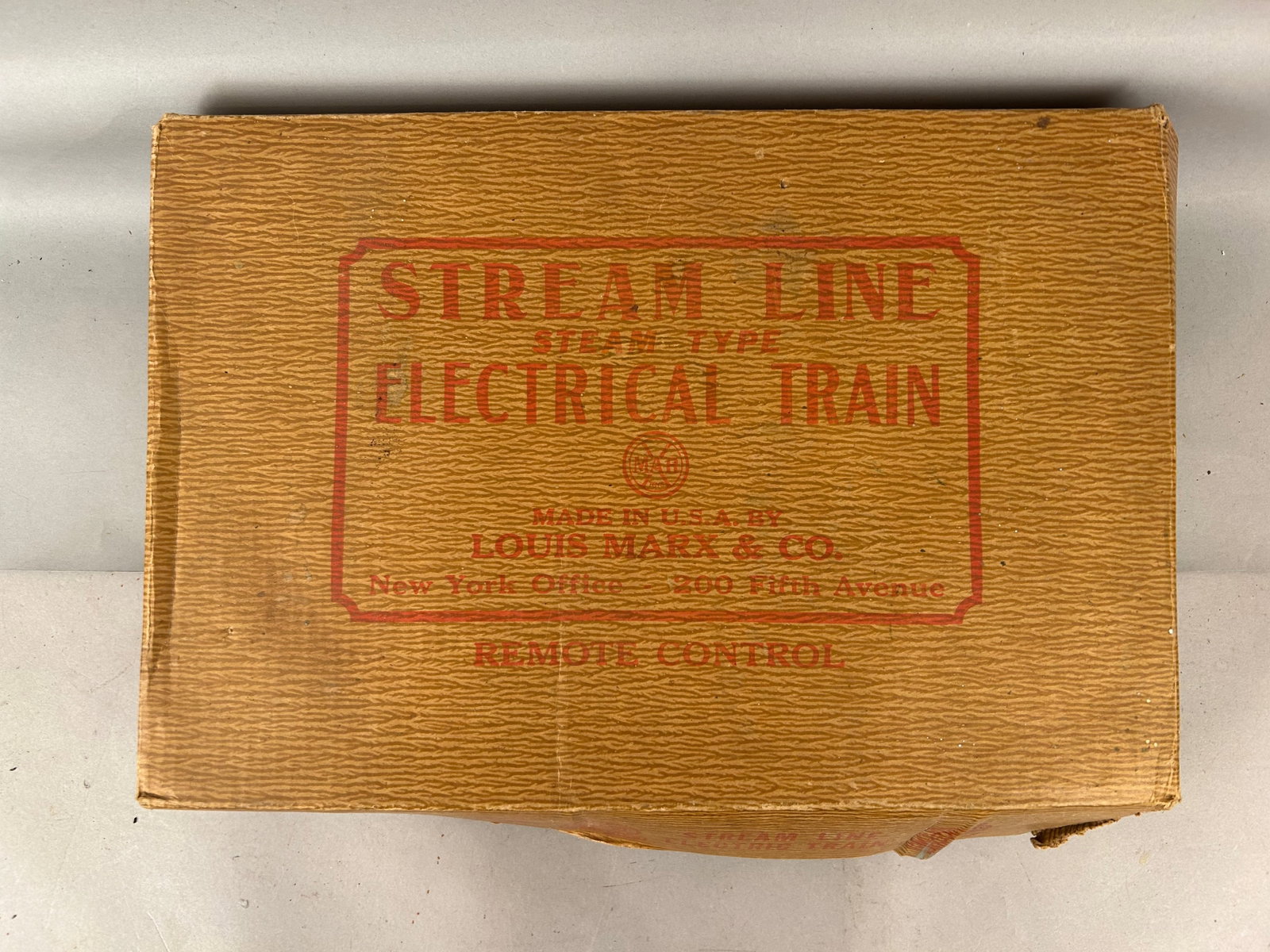 Louis Marx and Company transit in box: Louis Marx and Company transit in box. O scale. Includes all metal trains, steam locomotive with coal car, dumping car, caboose, coal car, box car, track and transformer. Note: items in box are not ne