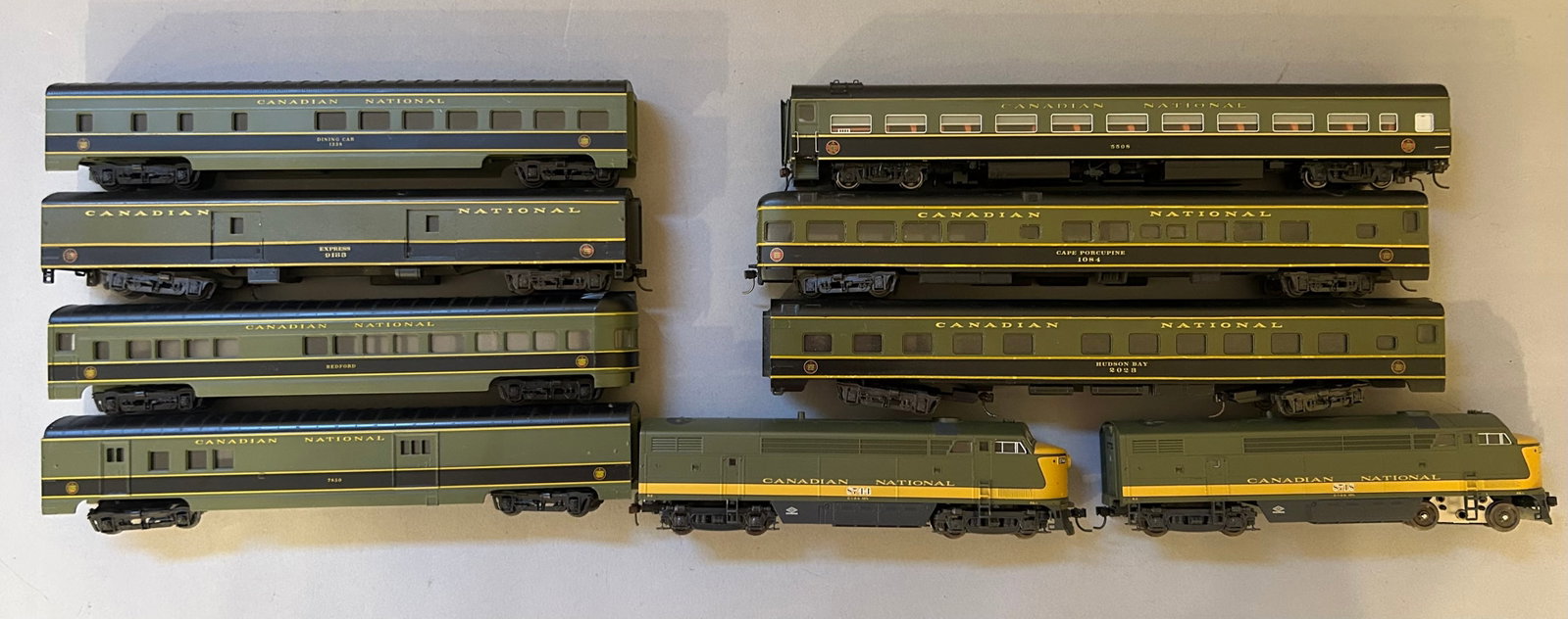 HO scale Canadian national Engines and Train Cars: HO scale Canadian national including diesel engines 8718, 8744. Seven passenger cars 7850, 1084, 5508, 2023, 9133, Bedford, 1338.